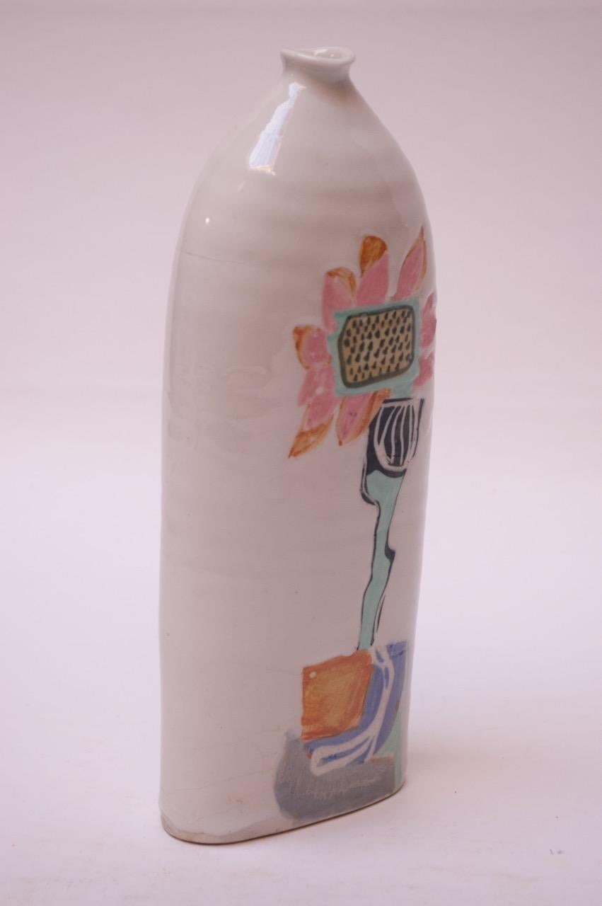 Tall 1976 Pollack vase / vessel in a white high-gloss glaze with colorful, hand painted floral decoration. 
Signed 