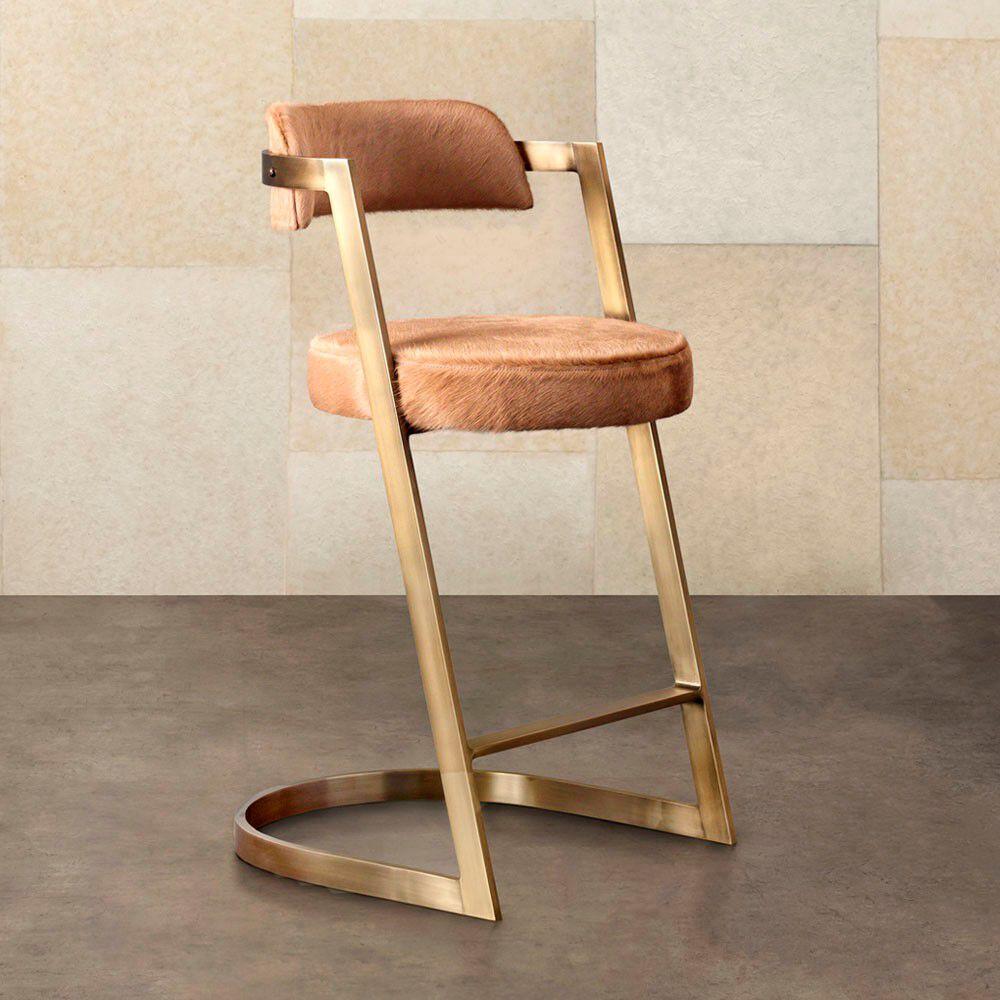 With its cantilevered profile and clean modern lines, the Studio counter stool celebrates purity in form and function. This stool features solid brass bar-stock in a Burnished brass or oil rubbed brass finish. The seat and backrest are available in