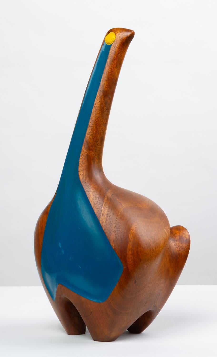 A large wooden sculpture by modern artist and woodworker, Carroll Barnes. A lumberjack educated at Cranbrook, Barnes often worked in large scale and his subject matter was drawn from American lore and natural beauty. On offer is a tall bird with a