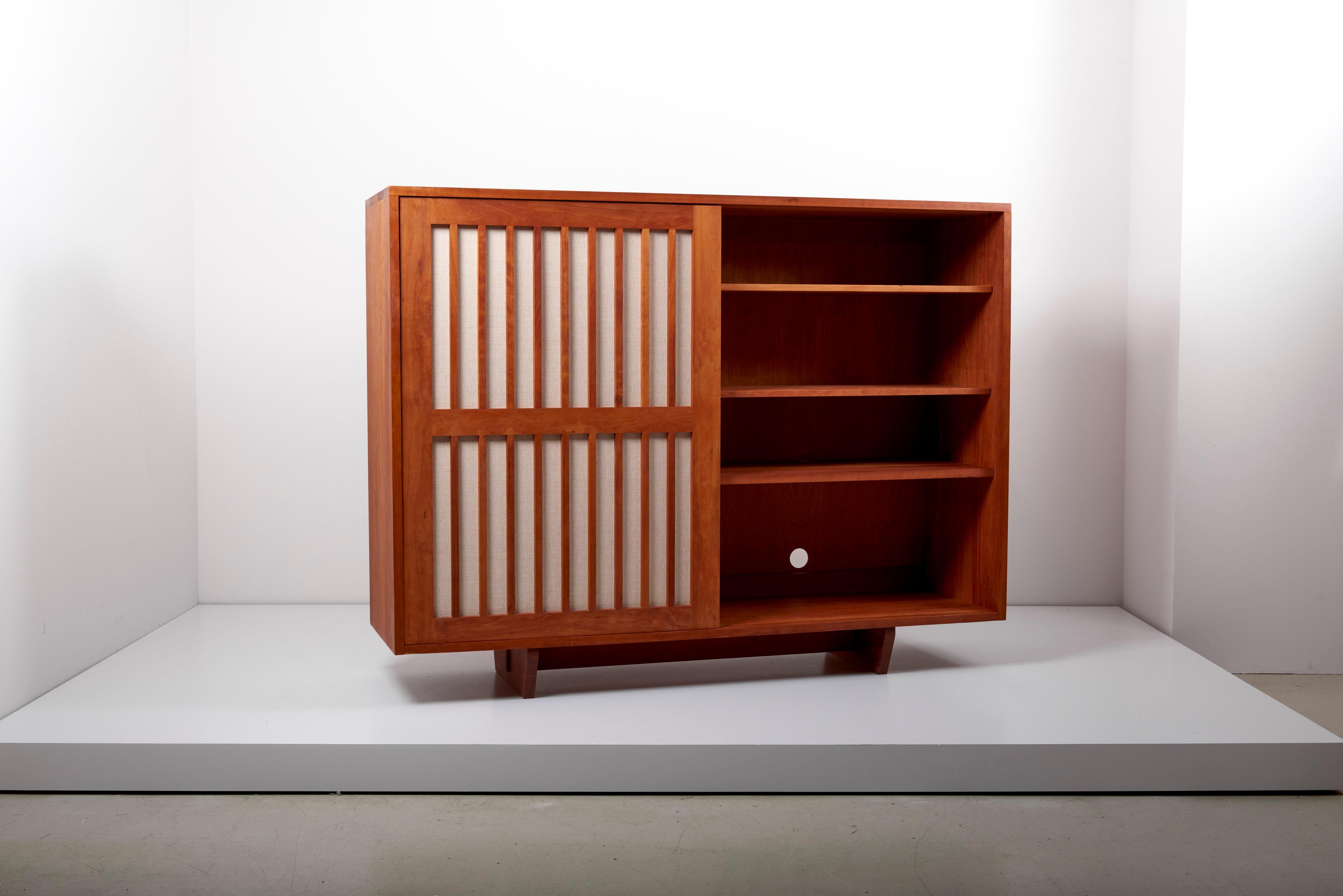 Wooden studio craft cabinet designed by Arden Riddle. This cabinet is made in American cherry.