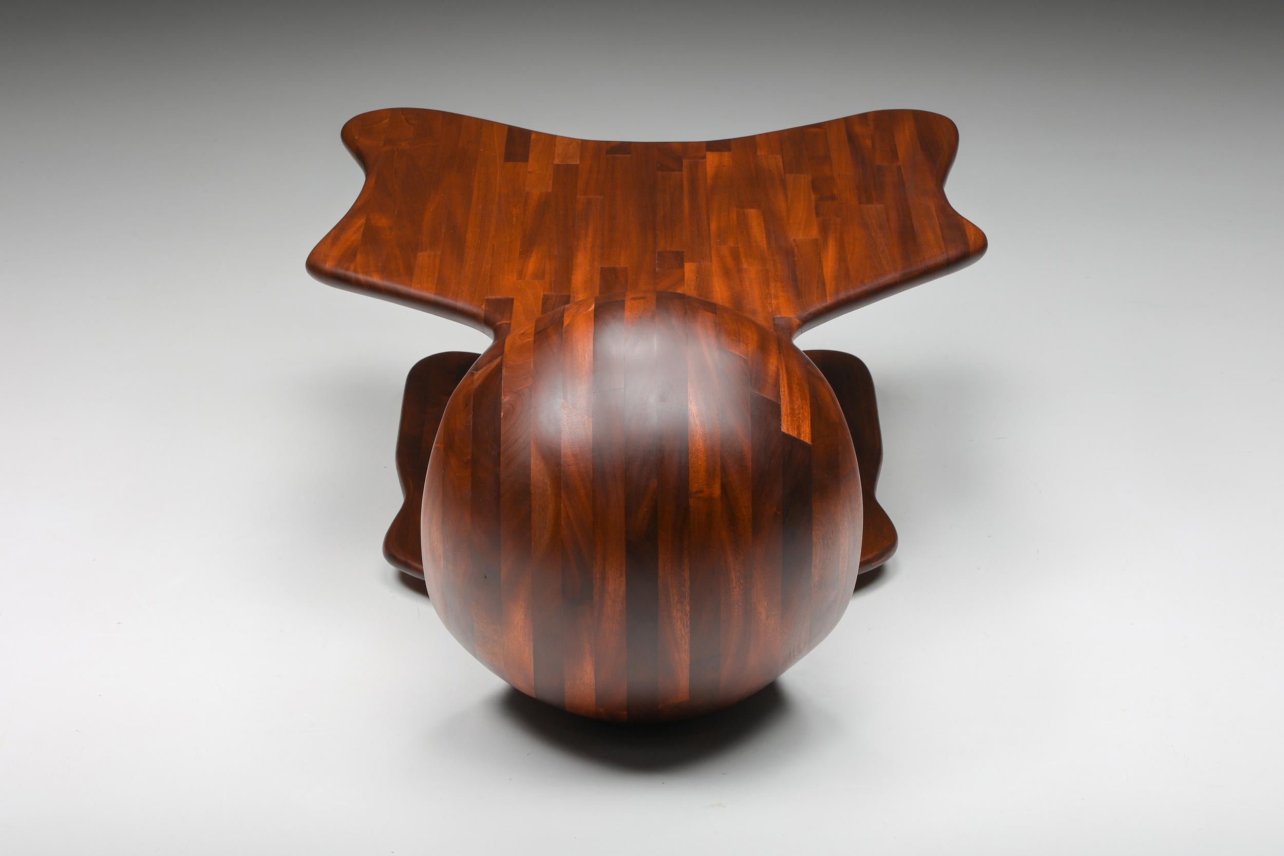 Modern Era coffee table; Studio Craft; Wendell Castle; USA: 1970's

Wendell Castle style freeform organic coffee table, studio craft, USA, 1970s. A Two-tier coffee table in dark wood, a protagonist piece of American Craft-based postwar art and