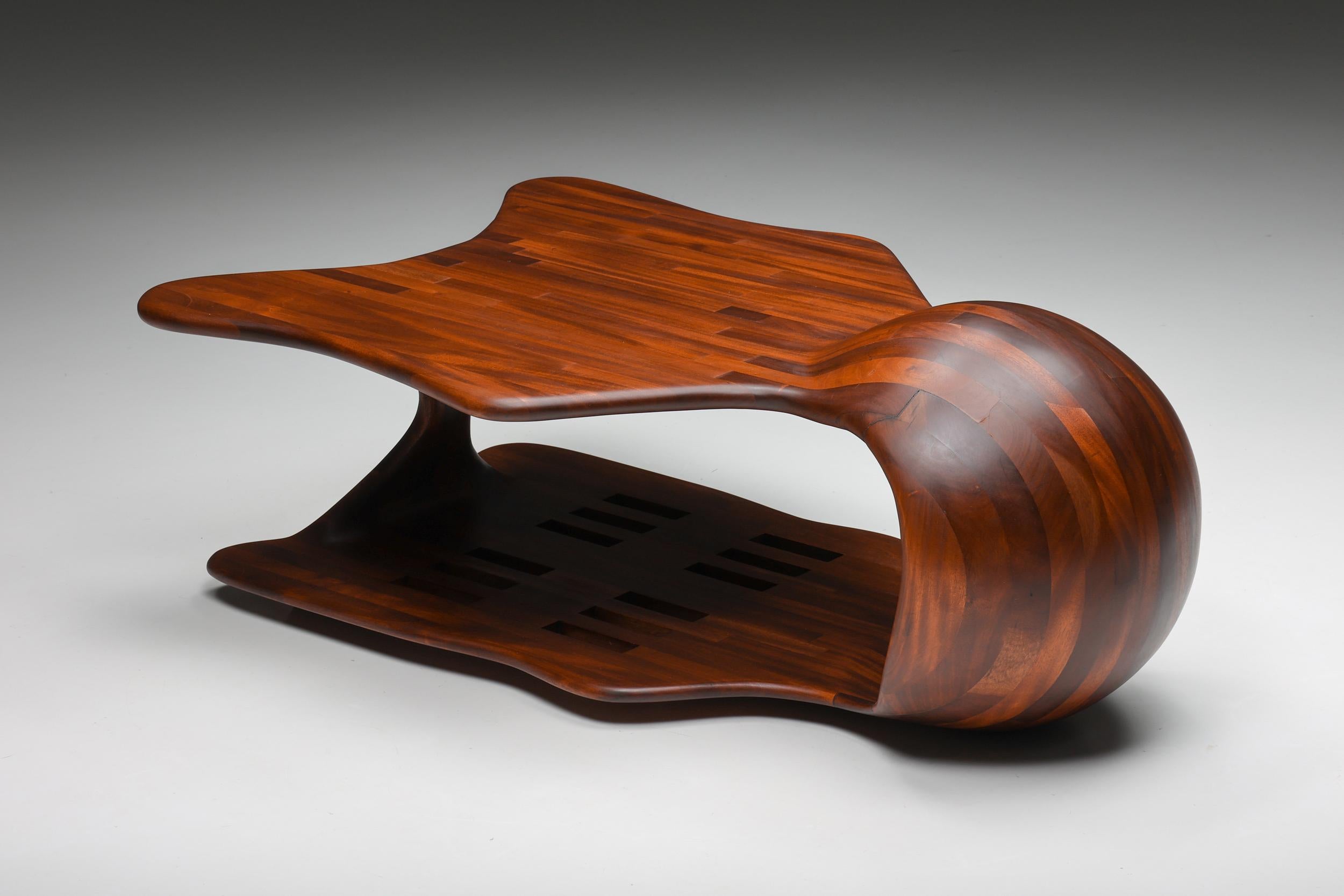 Modern Era coffee table; Studio Craft; Wendell Castle; USA: 1970's.

Wendell Castle style freeform organic coffee table, studio craft, USA, 1970s. A Two-tier coffee table in dark wood, a protagonist piece of American Craft-based postwar art and