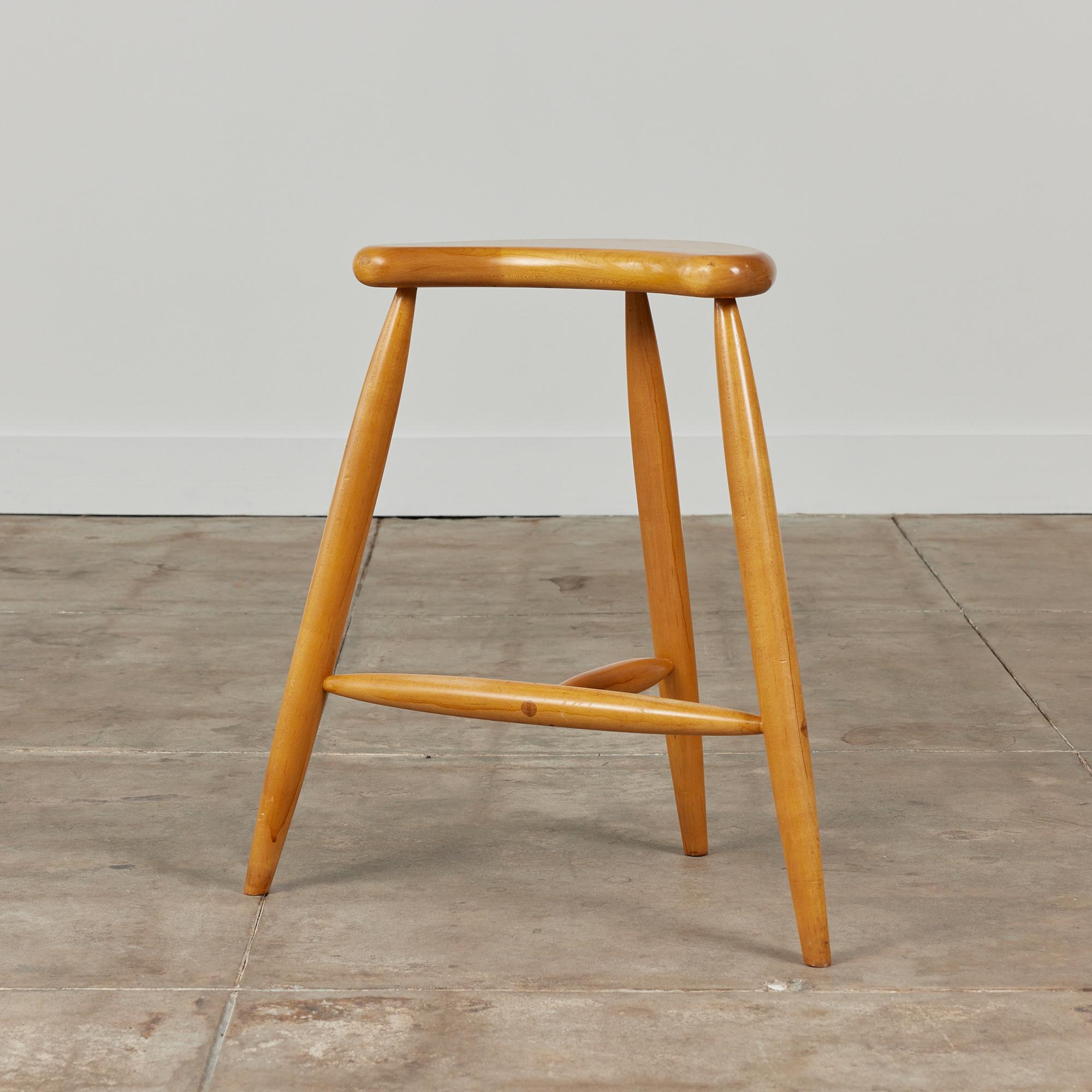 Studio craft stool made by P. Goodrich c.1995, Rhode Island. The maple stool showcases a minimalist design with a crescent seat with rounded edges. The stool is supported by three dowel legs with stretchers.

Signed P. Goodrich -