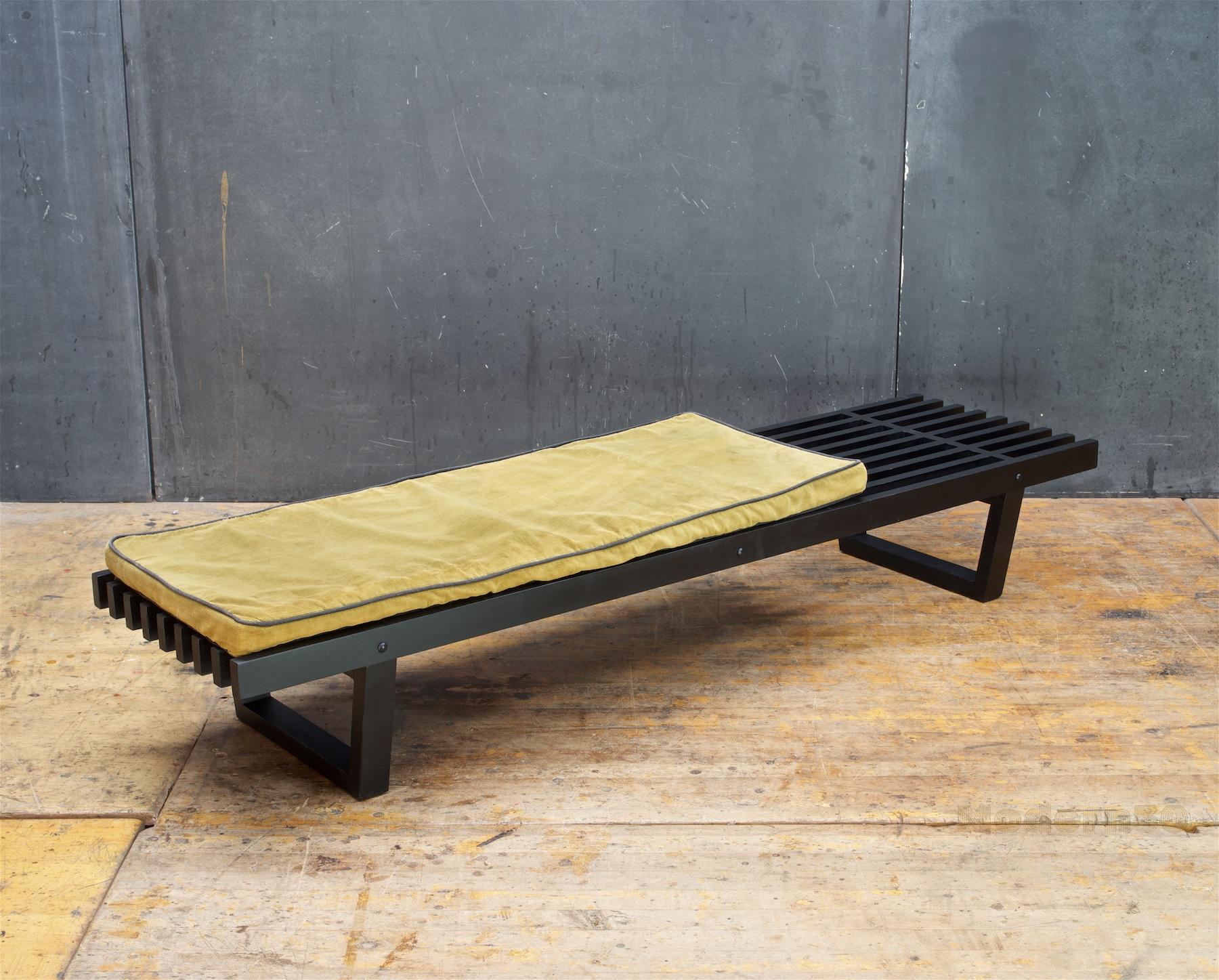 A well crafted 9.5 inch high slatted platform bench or table. The old pillow will be included for sizing, but fairly worn and foam is hard.

This design is in the manner of Martin Borenstein for Brown Saltman of California. However, we have no