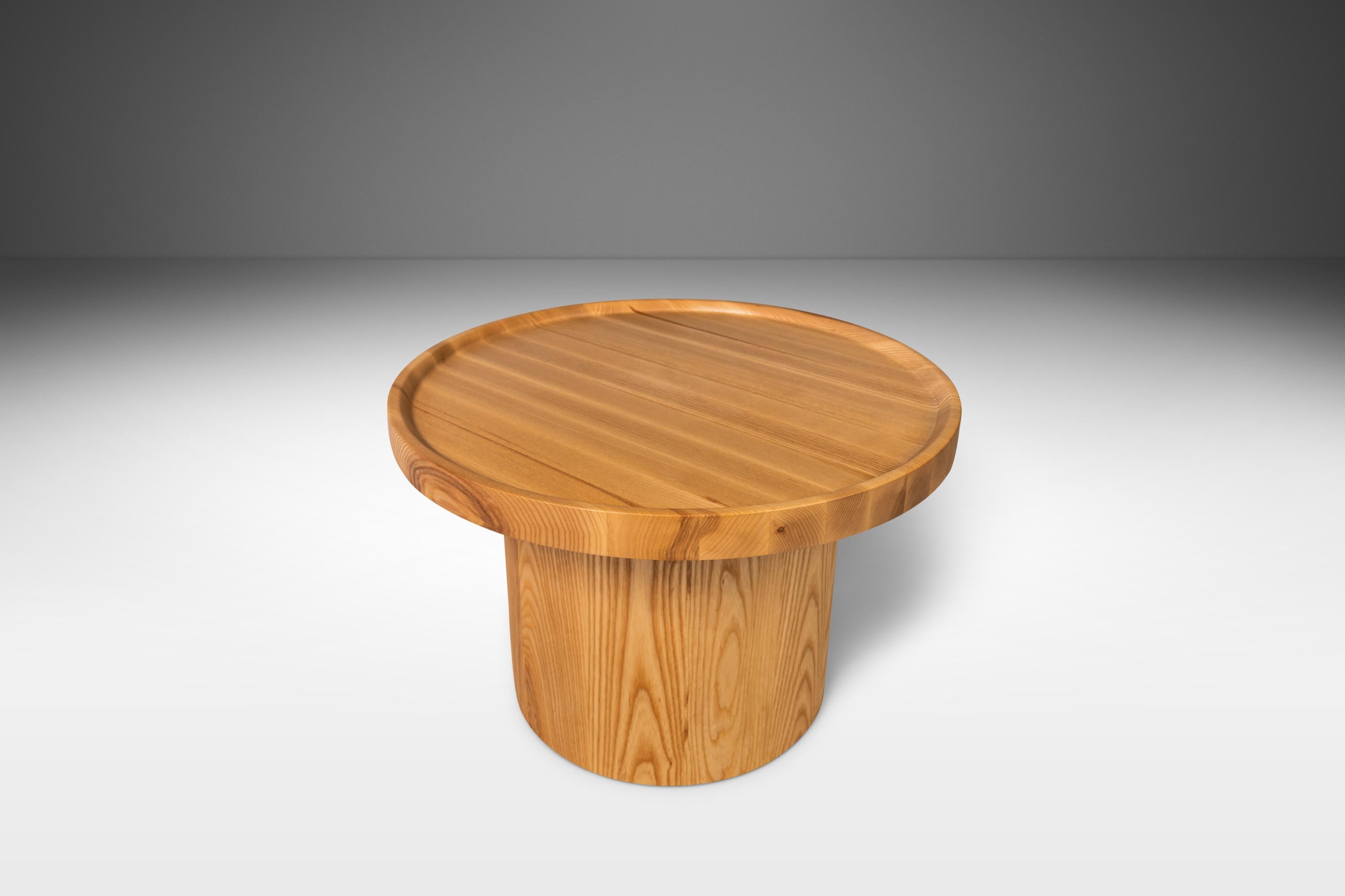 Combining natural materials with classic clean lines, rounded shapes, and smooth surfaces this coffee table is the very definition of 'Organic Modern'. Handcrafted from sustainably-sourced solid ash, which features extraordinary old-growth