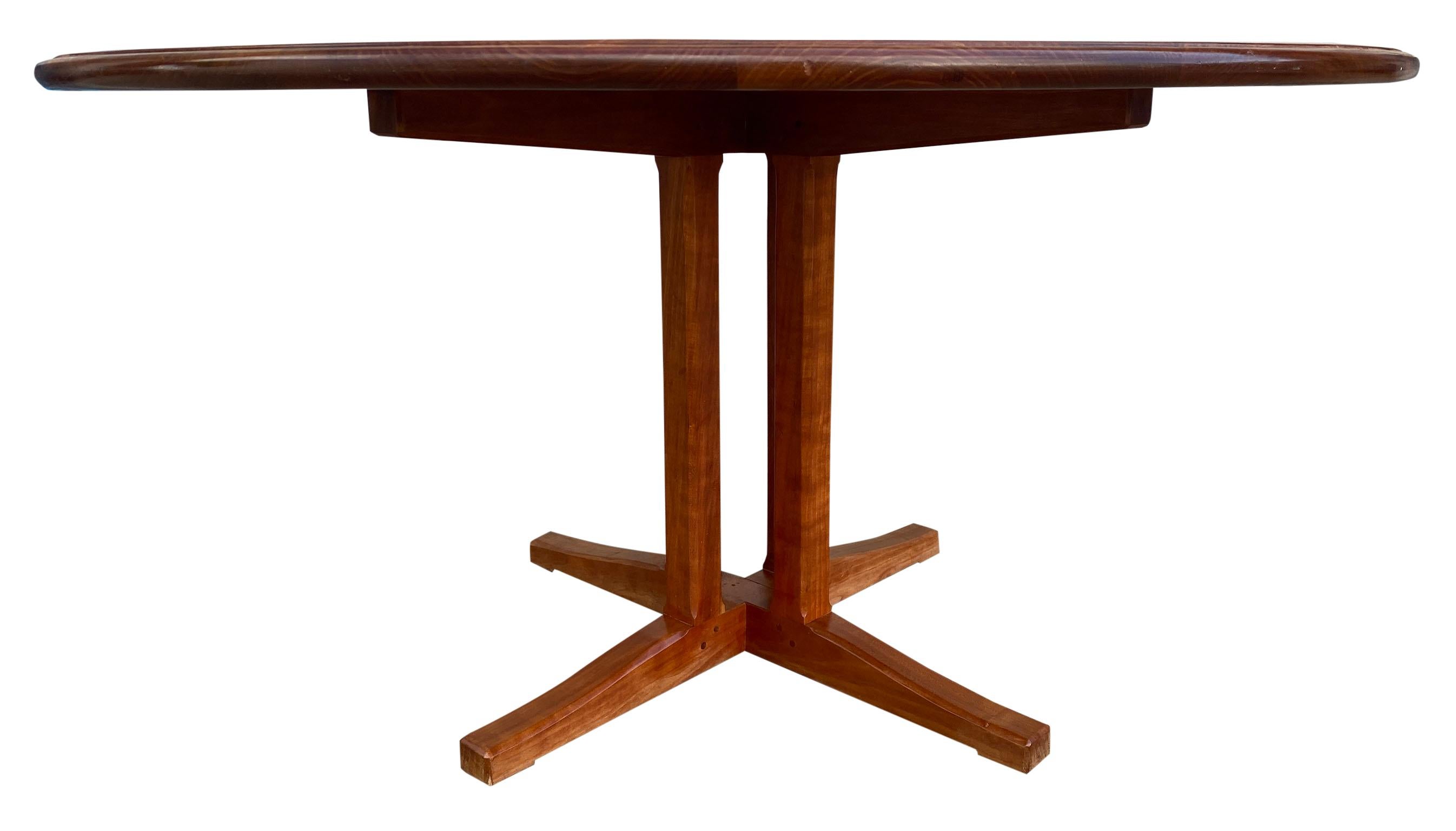Stunning studio craft round solid cherry dining table by Charles Shackleton made in Vermont, circa 1995. Stamped DR - beautiful handcrafted dining table. Beautiful solid cherry cluster base and 1.250