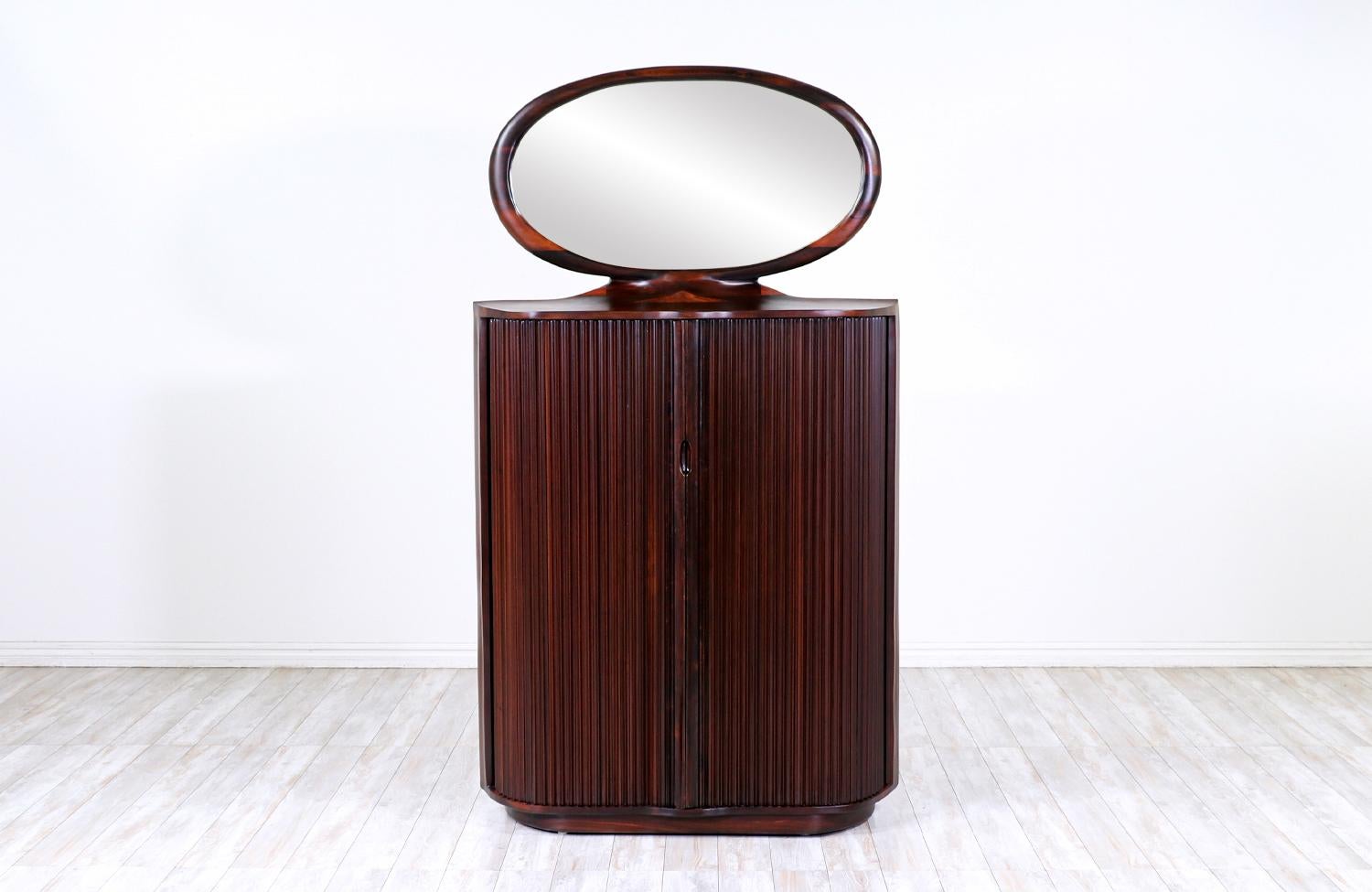 Studio craft solid rosewood tambour-door bachelor's chest of drawers.

________________________________________

Transforming a piece of Mid-Century Modern furniture is like bringing history back to life, and we take this journey with passion and