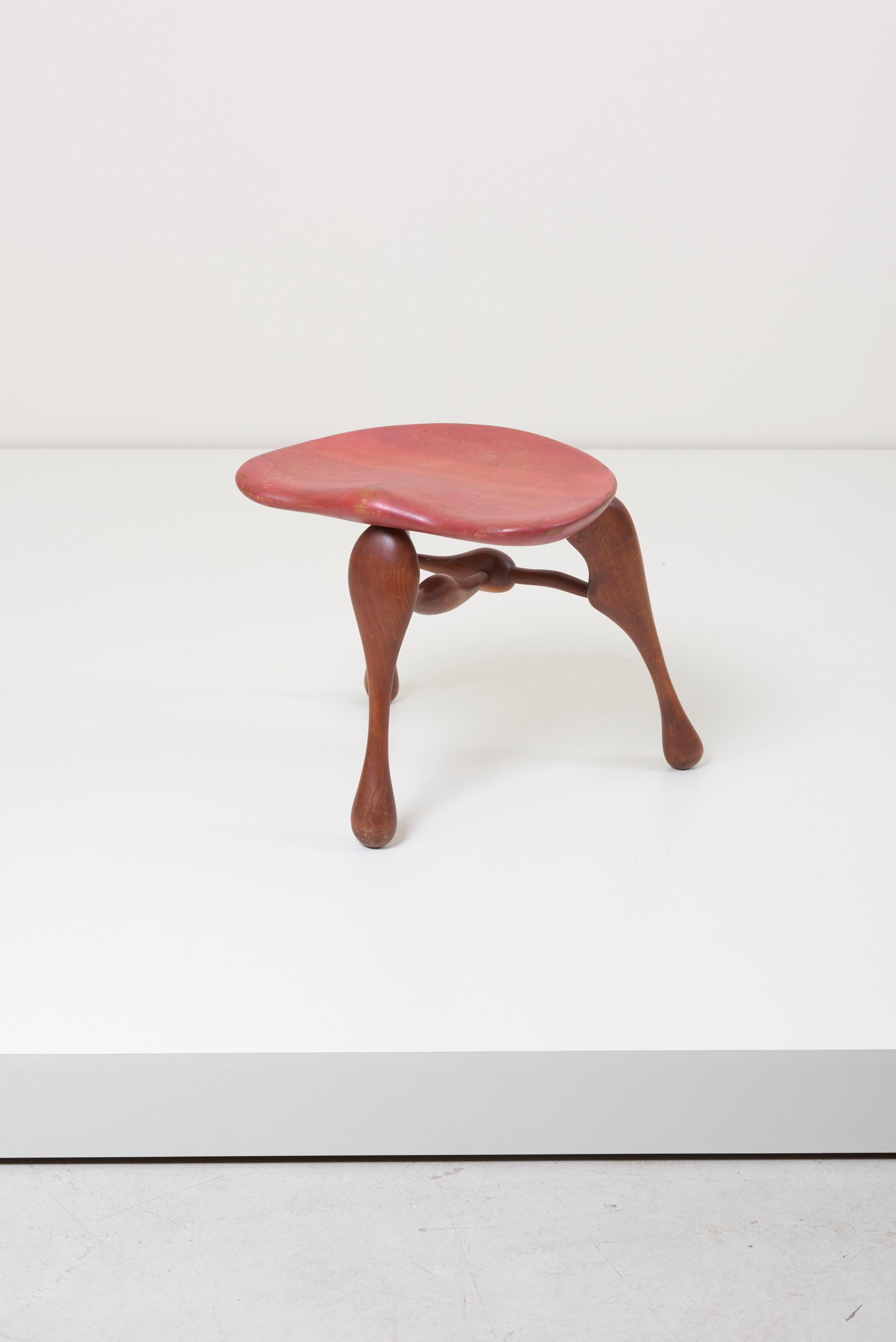 Sculptural handcrafted three legged stool by noted studio furniture maker Ron Curtis.