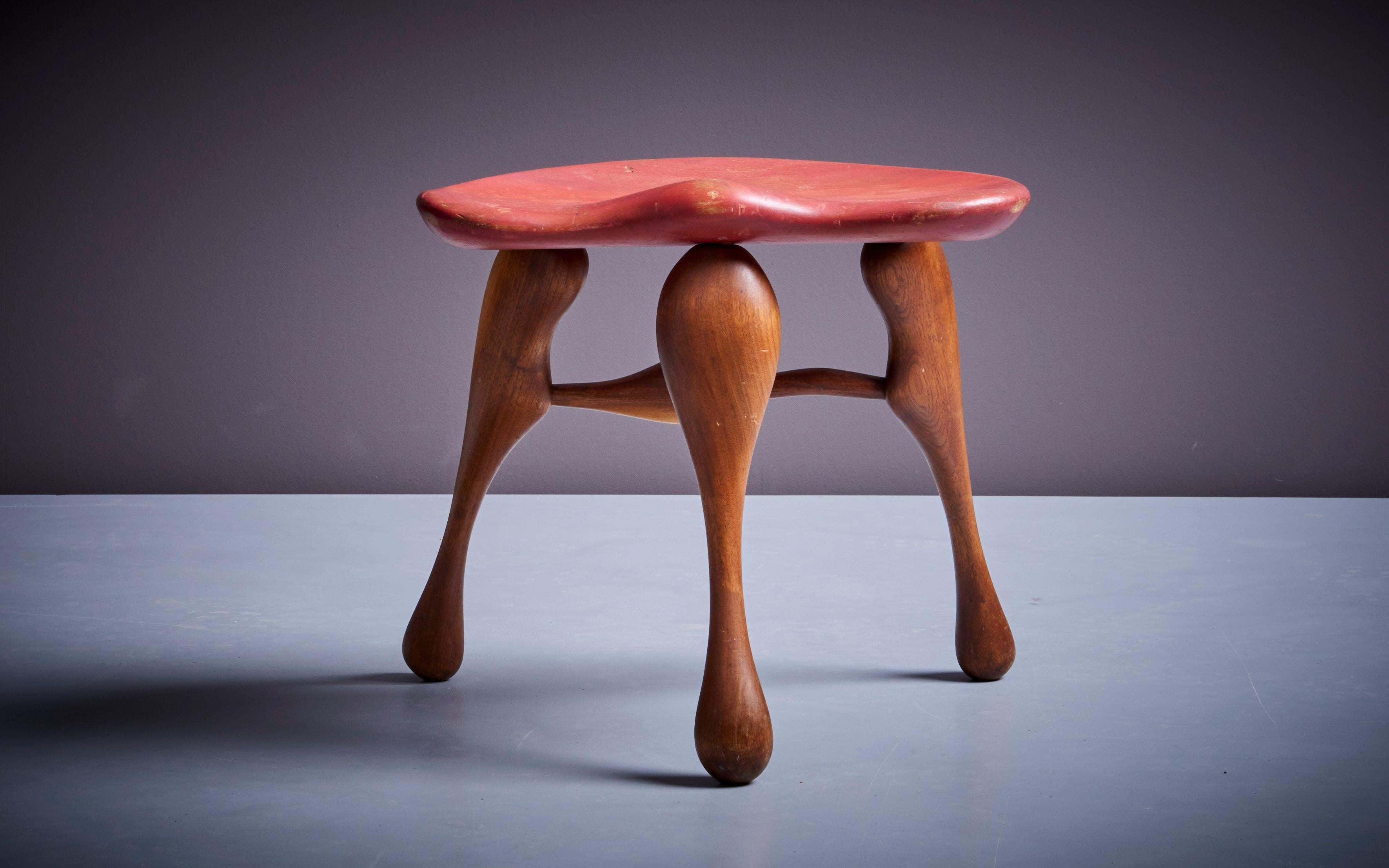 Sculptural handcrafted three legged stool by noted studio furniture maker Ron Curtis.