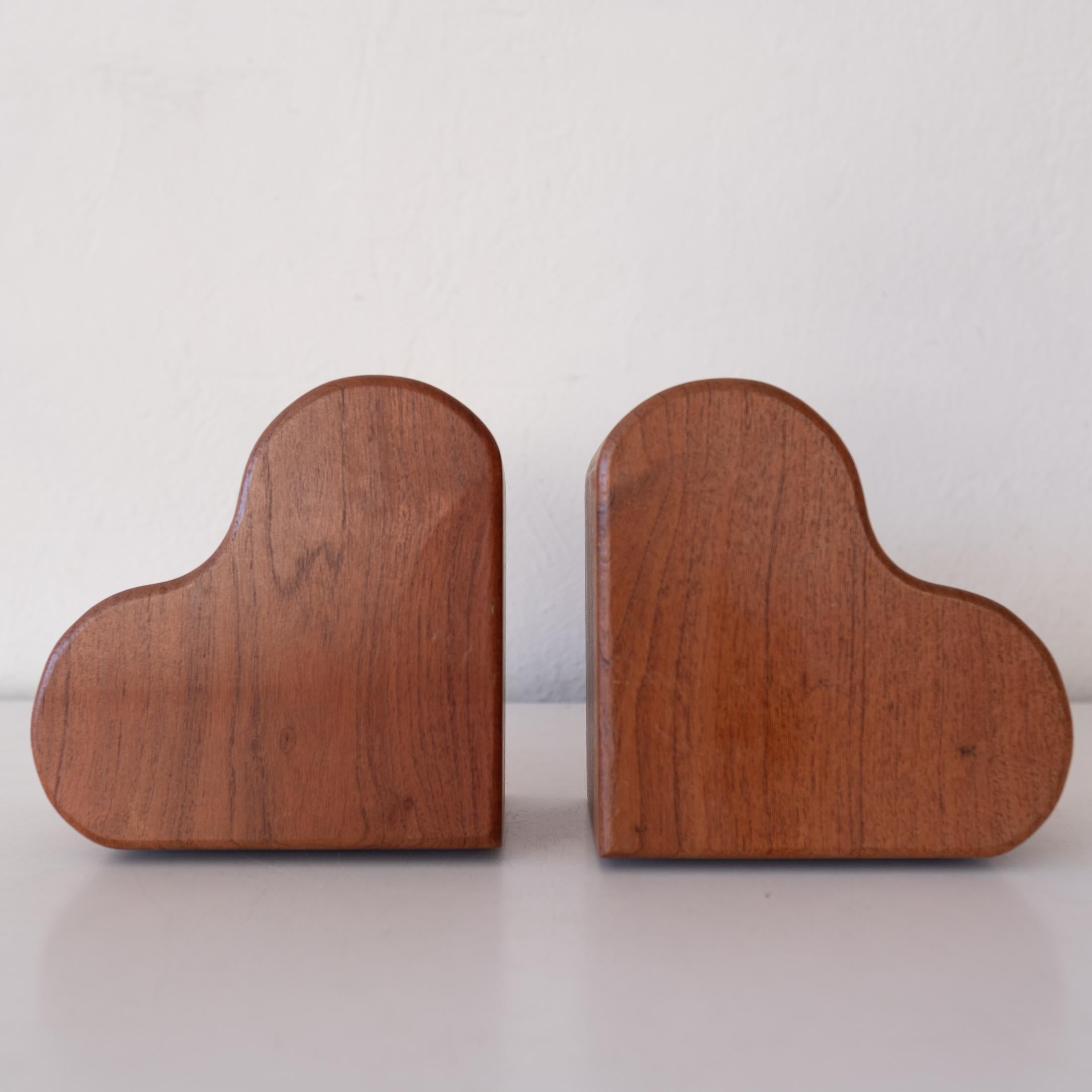 Sweet pair of Studio Crafted Wood Heart Bookends for the book lover in your life. Solid carved wood. 
