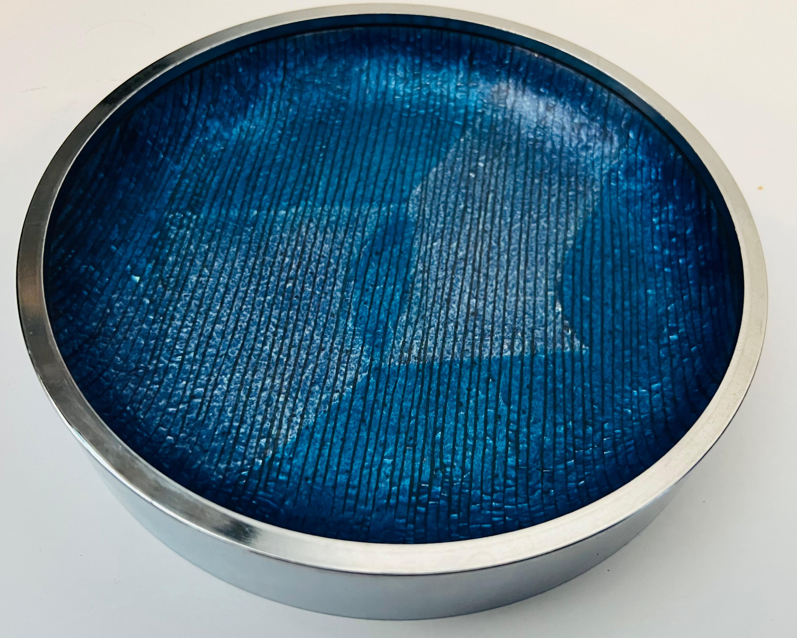 An original sleek 1960s polished steel and blue/violet enamel  bowl by the famed Italian Studio of Del Campo. Signed 