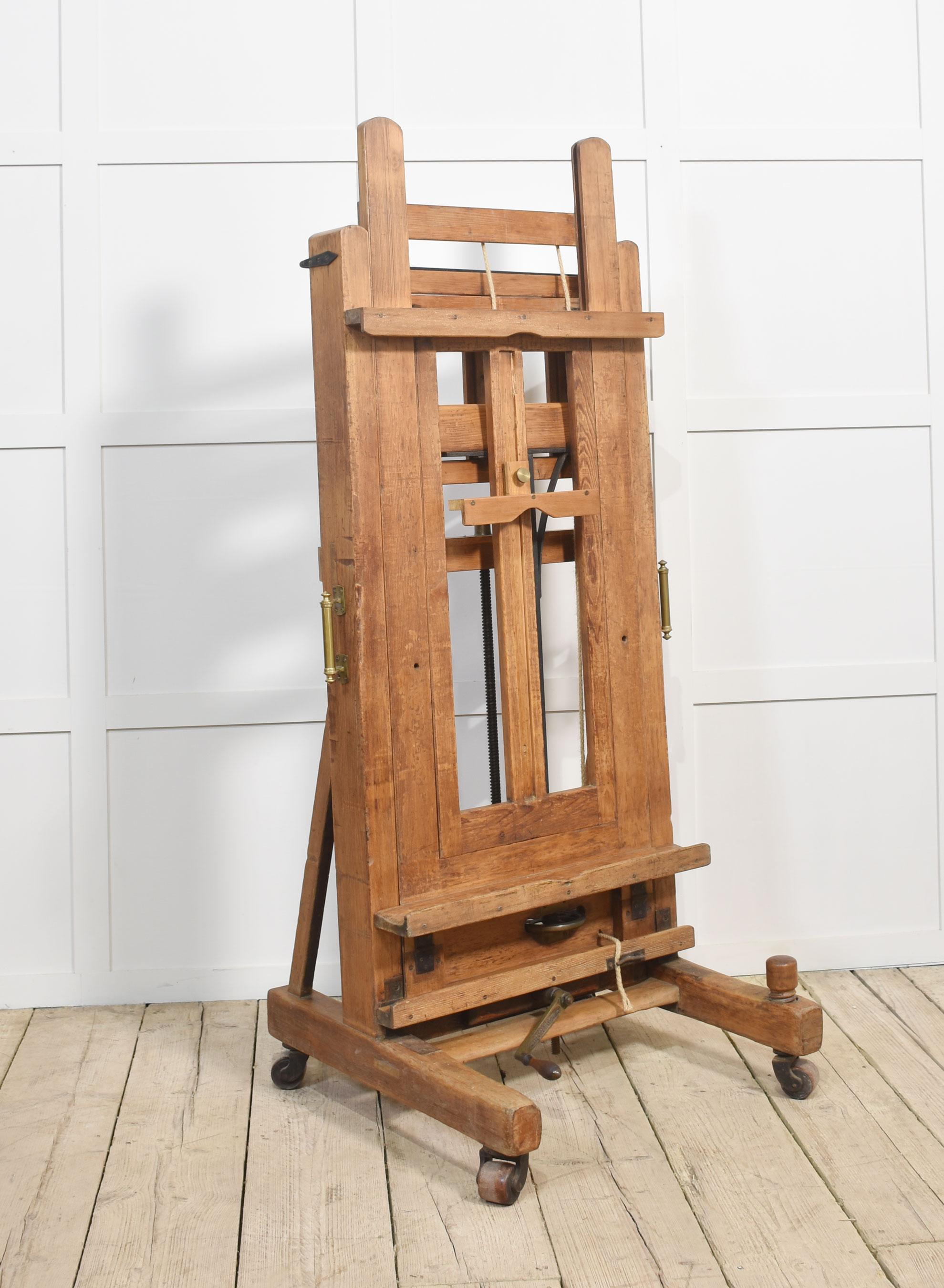 Large Windsor and Newton artist’s fully adjustable studio easel raised up on trestle base terminating in four lignum vitae casters
Dimensions
Height 71.5 Inches ajustable to 97 Inches
Width 31.5 Inches
Depth 28 Inches