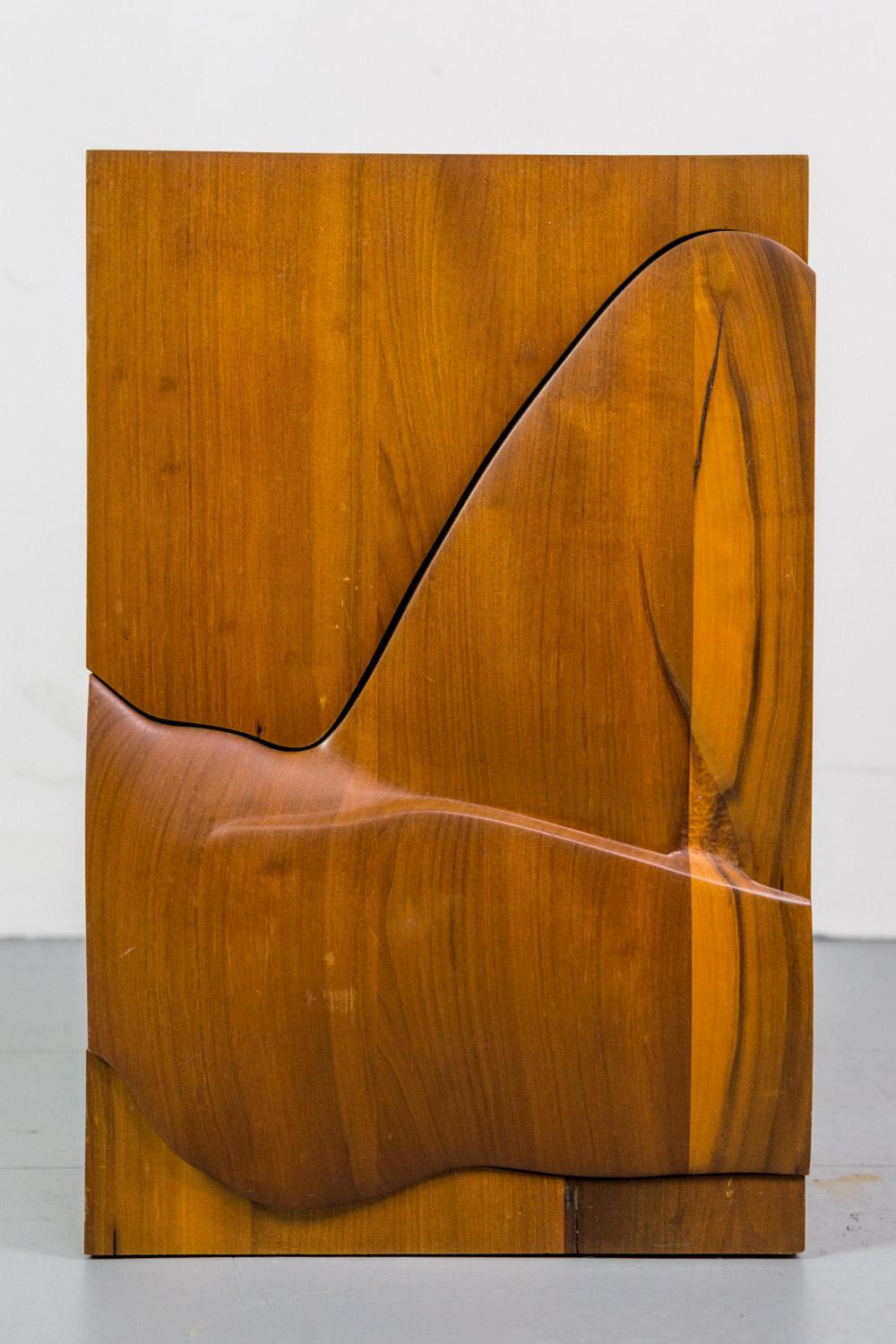 Sculptural freeform cabinet or chest in solid walnut.