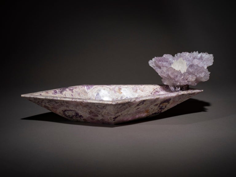Studio Greytak’s Bling Bowl 8 brings the history and beauty of the prized amethyst to your home. An artfully hand carved amethyst bowl grounds and provides a landscape for a purple amethyst firework to erupt from. Centered in the colorful burst is a