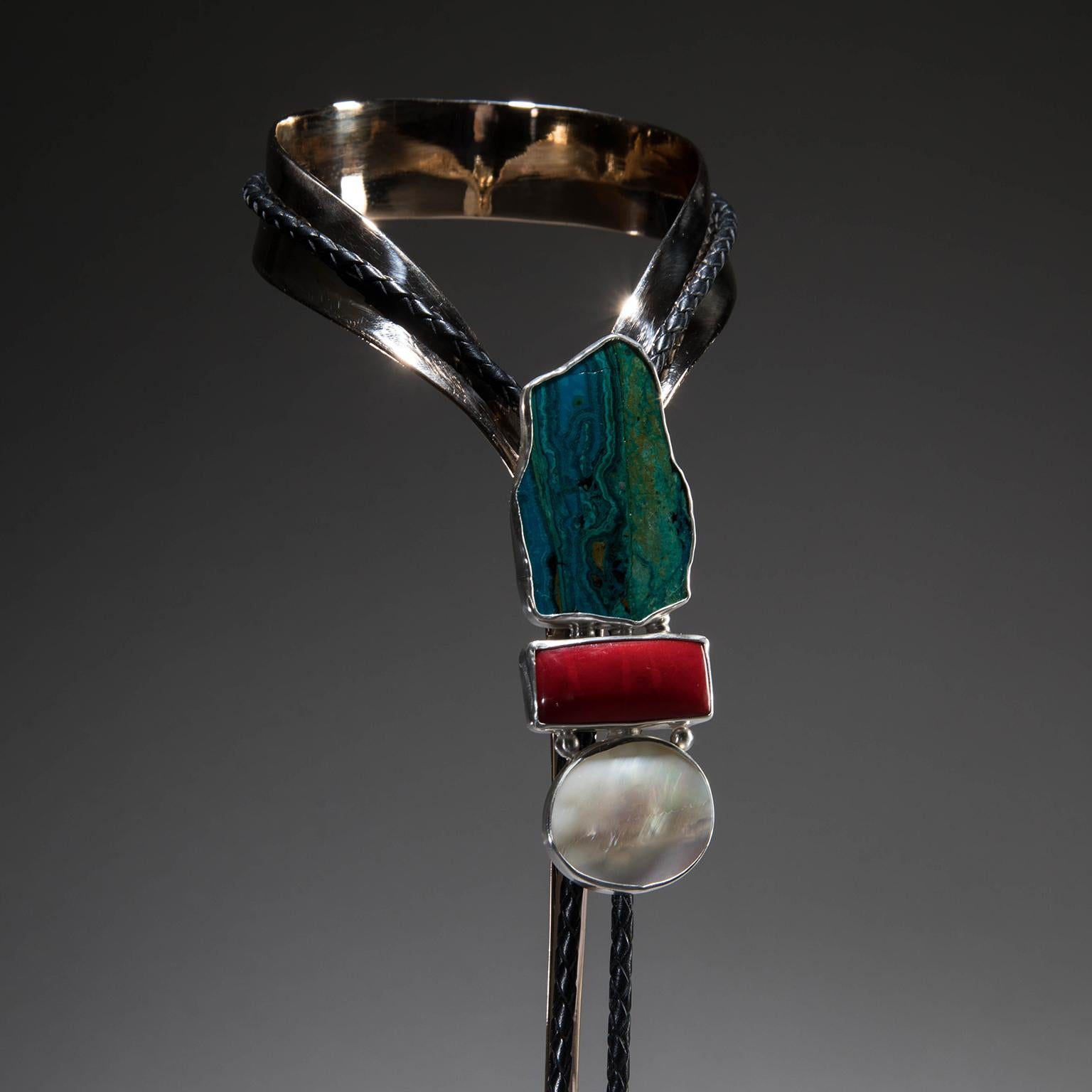 Chrysocolla Bolo Tie on Selenite.

The infinite rhythms of the ocean whisper from studio Greytak’s Chrysocolla Bolo Tie on Selenite. This lariat necklace features tropical waves of teal, aqua, and sea blue flow toward a sandy beach in a stunning