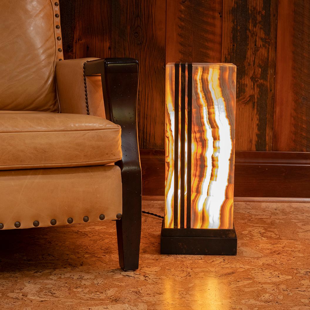 Deco Glo

Studio Greytak’s Deco Glo takes its inspiration from the boldness and hopefulness inherent in the Art Deco style. A glowing pillar of aragonite is carved with geometric precision and displayed on a pedestal of layered bronze, the metal