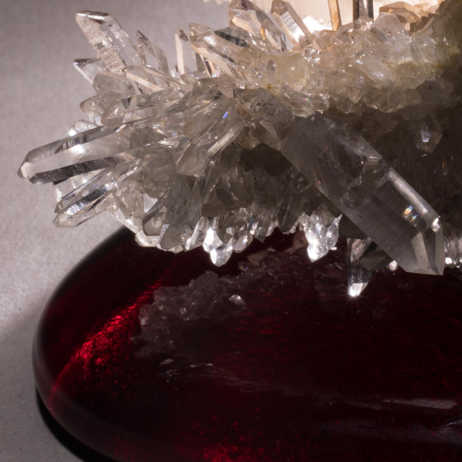 Himalayan quartz on cast glass

Himalayan quartz on cast glass is as dramatic as the remote mountains where this stunning quartz is found. The flowing ruby red base demands attention while subtly carrying the clear crystal points of this