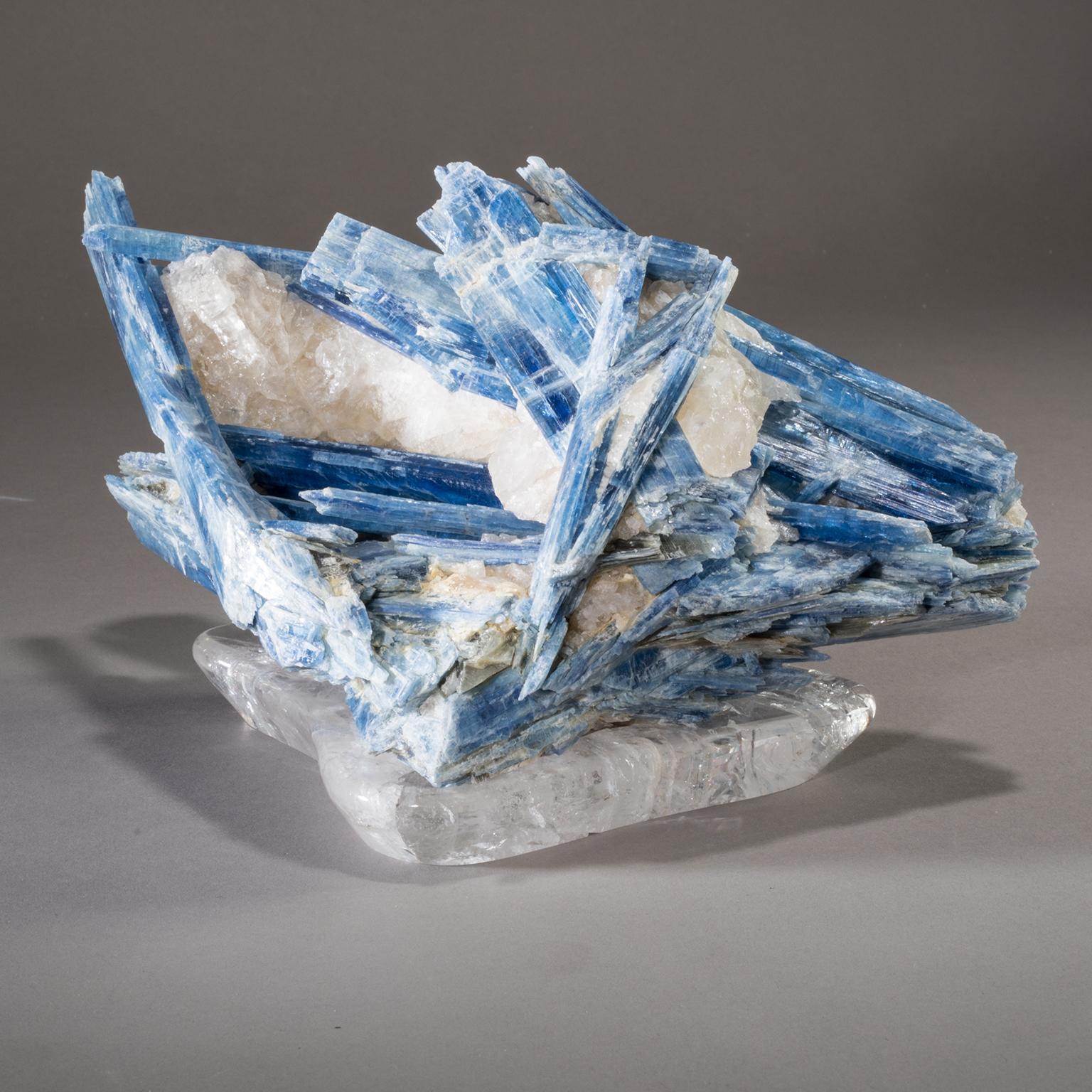 KYANITE ON CRYSTAL BASE

Shards of vibrant blue kyanite climb towards the heavens in Studio Greytak’s Kyanite with Quartz on Crystal Base. Like the remnants of a hidden staircase ascending Mount Olympus, the kyanite juts out from unyielding quartz