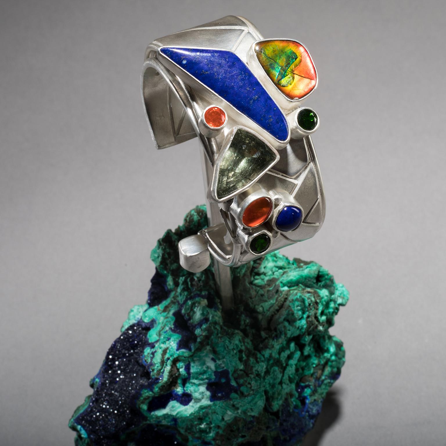 LAPIS CUFF ON AZURITE

A blade of midnight blue lapis lazuli slices boldly across a silver cuff in Studio Greytak’s Lapis Cuff on Azurite. Thought to guide the soul to heavenly contemplation, this bluest of blue stones has been part of some of