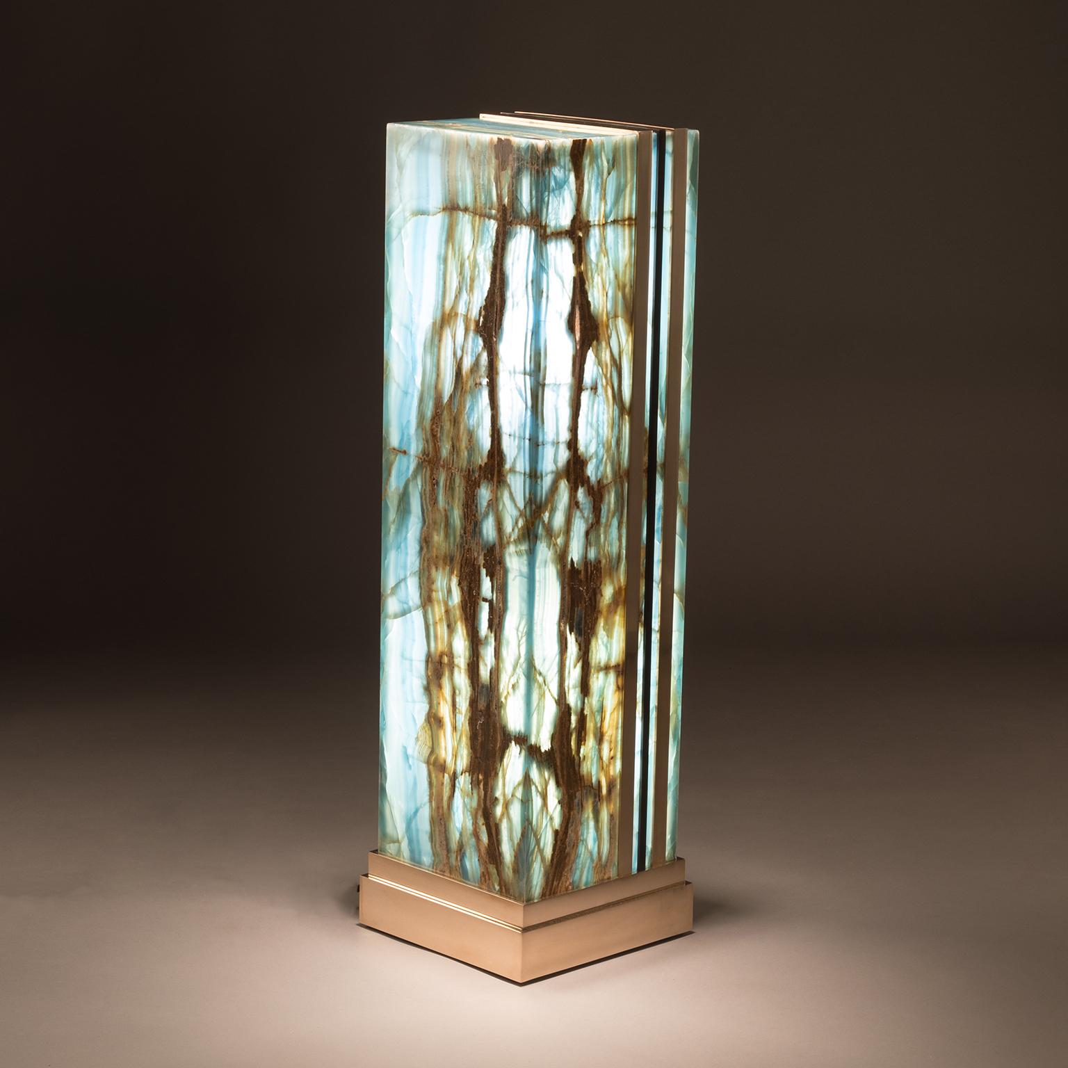 LARGE BLUE LEMANS GLO

Studio Greytak’s large blue Le Mans Glo calls to mind Degas’ dancers. Streaks of gold dance through a pillar of blue aragonite like ballerinas captured mid-arabesque. Inside, a soft glow hints at the graceful but ever-changing