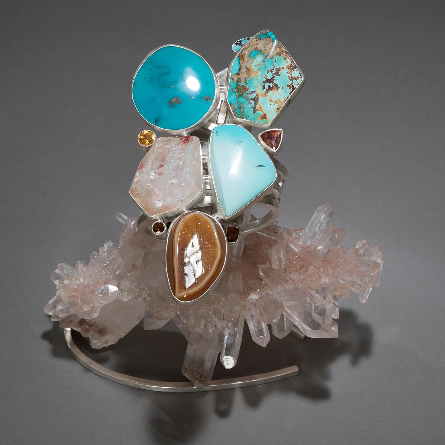TURQUOISE BRACELET ON HIMALAYAN QUARTZ

Warriors in civilizations throughout history have relied on the power of turquoise for its strong defensive properties. In Studio Greytak’s Turquoise Bracelet on Himalayan Quartz, a trio of the guardian stones