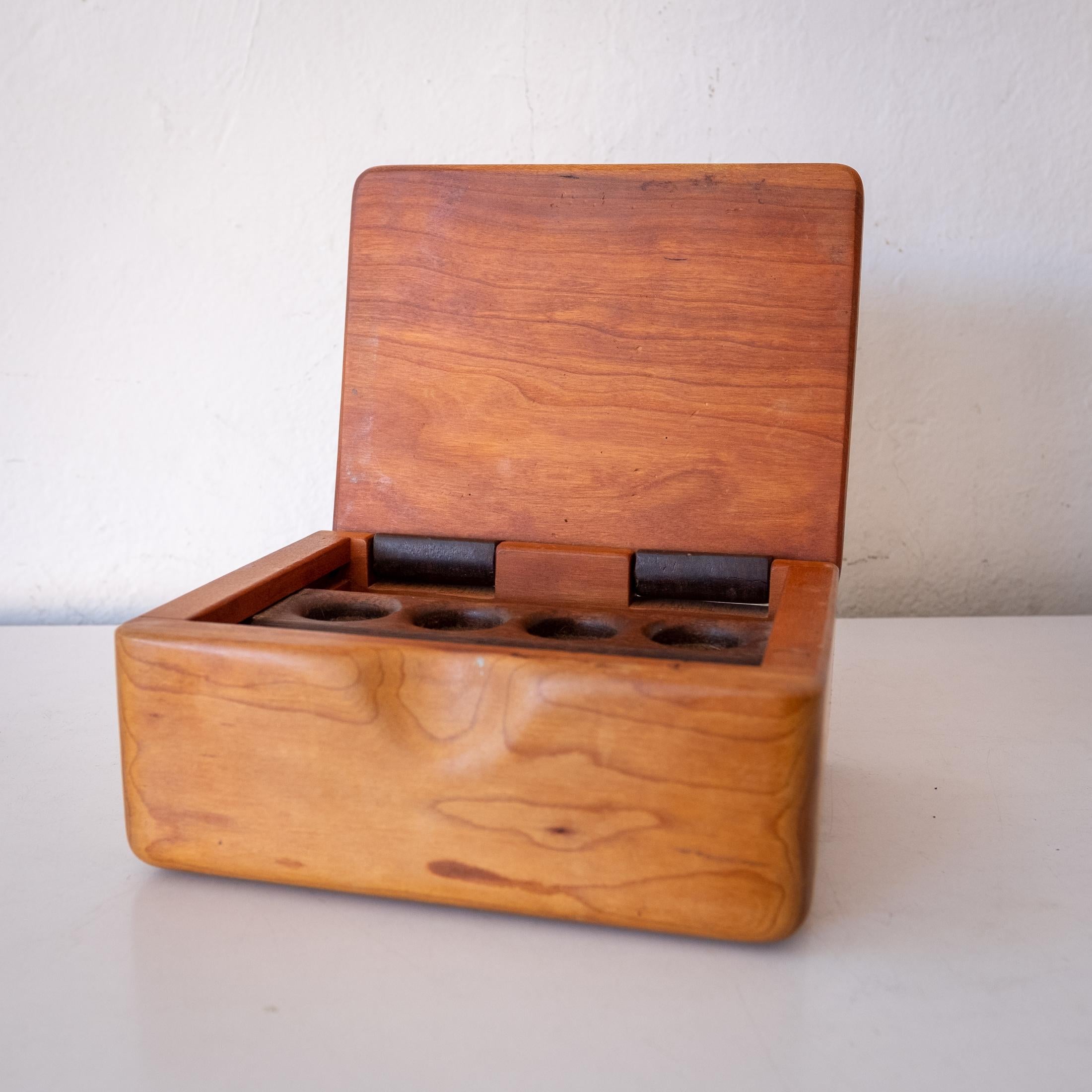 Handcrafted wood jewelry or trinket box from the 1970s. Felt lined with a sliding ring holder. Nice joinery and mix of woods. 