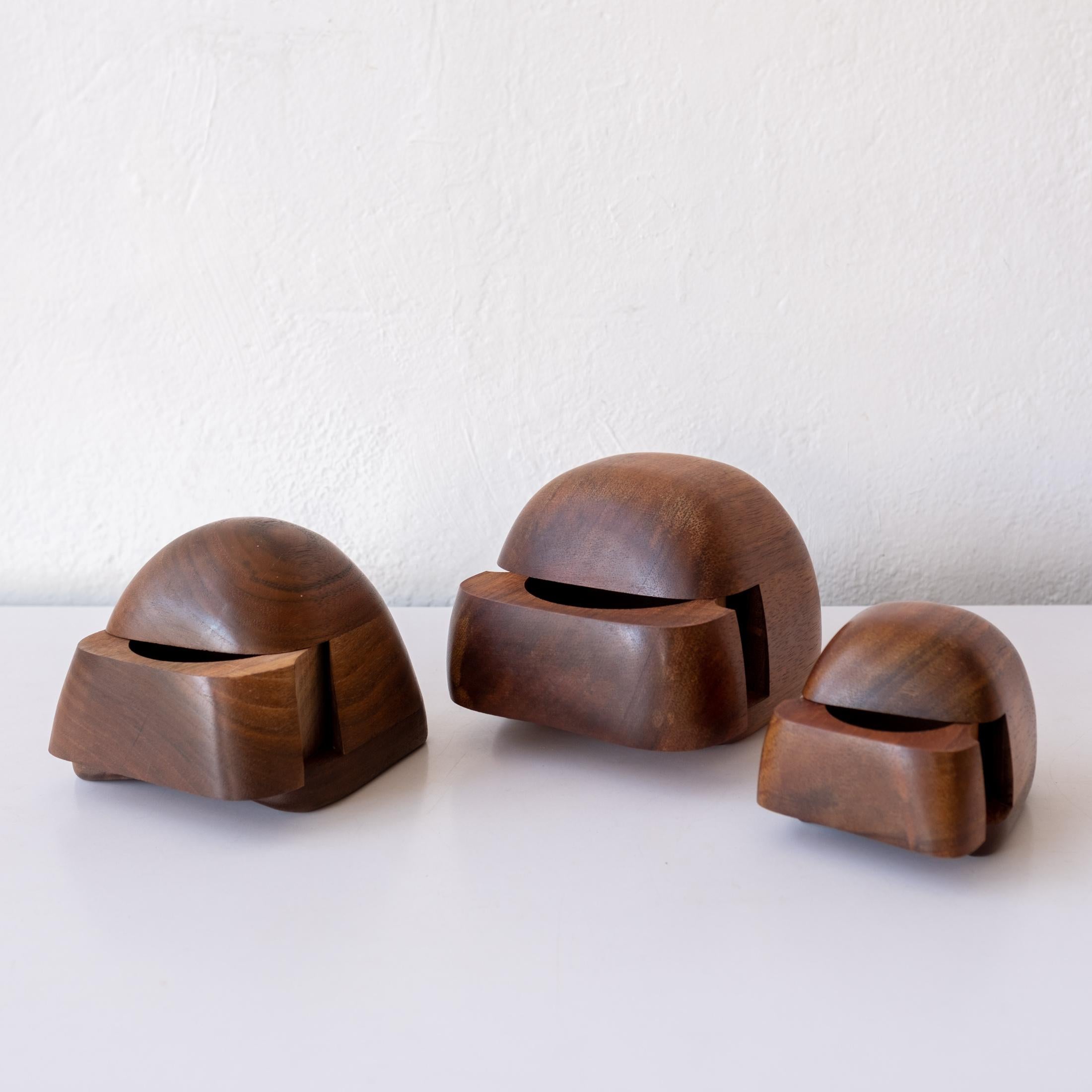 Three handcrafted wood jewelry or stash boxes from the 1970s by Designed by California woodworker, Dean Santner. Expertly crafted in walnut. Felt lined. 

 The largest box is 4