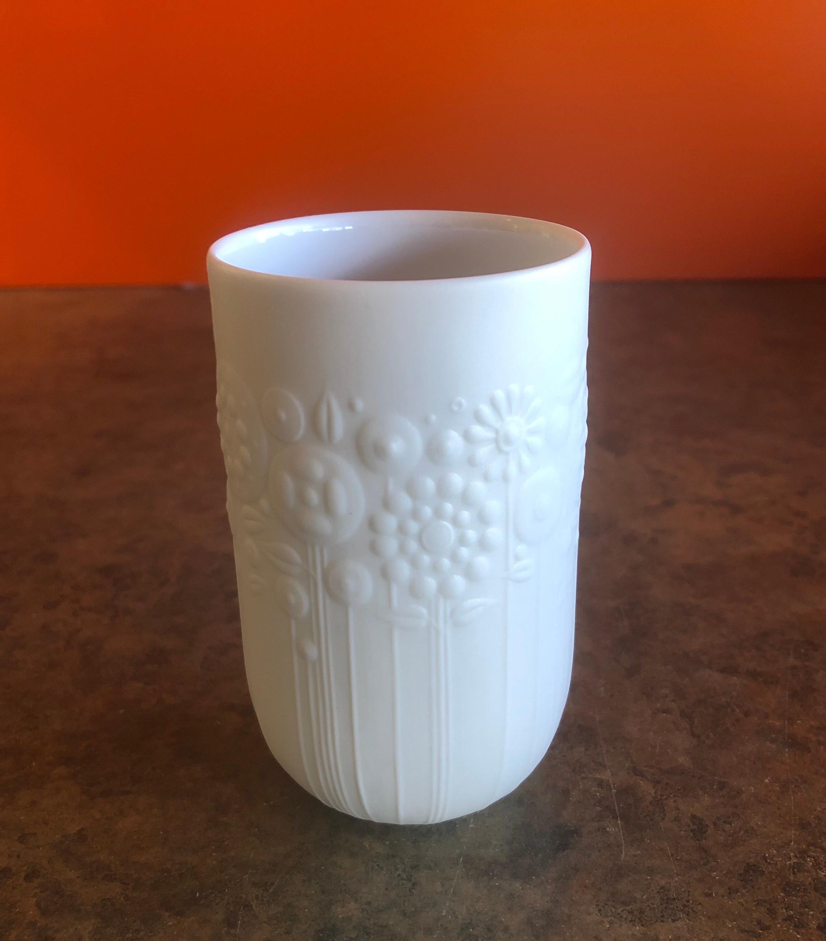 Floral motif Studio Line vase by Bjorn Wiinblad for Rosenthal, circa 1970s. The vase is signed by Danish artist-cum-designer Bjorn Wiinblad for Rosenthal of Germany as part of their extensive artist-led Studio Line series.

The vase is made of