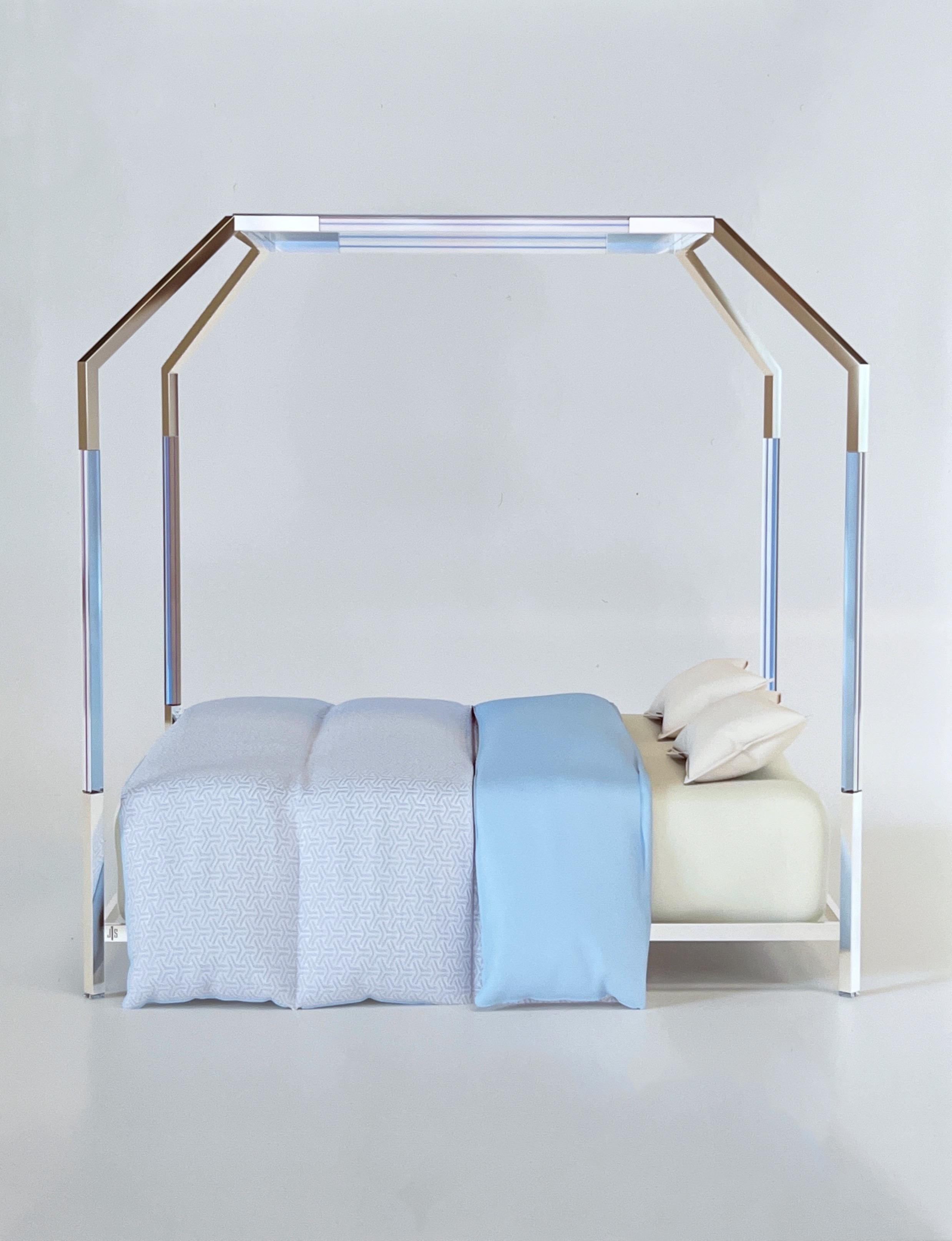 Glamorous limited edition lite blue lucite and polished nickel canopy bed by renowned American designer Charles Hollis Jones. 
It’s signed and numbered 2 of 7. 
California king size. 
Measurements: 91” Deep, 79” Wide, 92” High. 
All rights