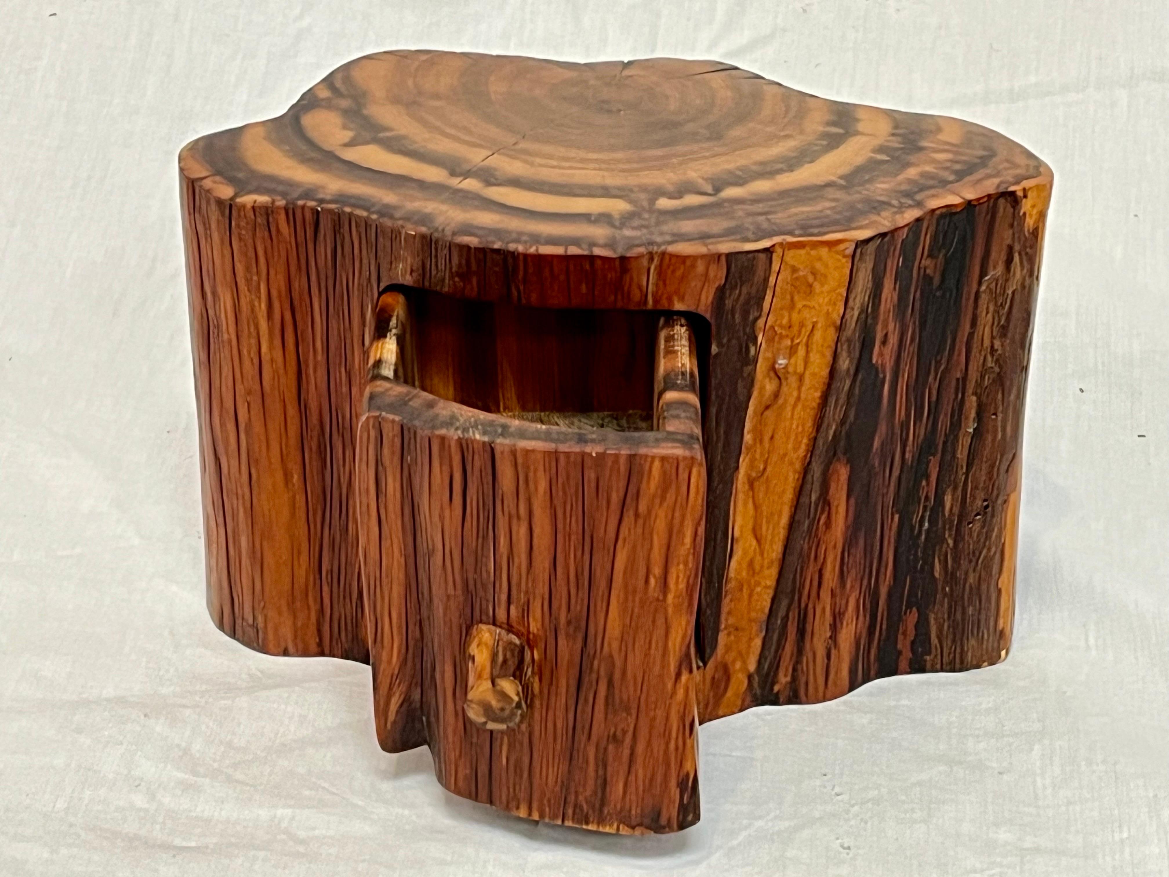 A fantastically secretive American studio craft organic free form jewelry or stash box. The wood, Juniper I believe, plays an integral part to the beauty of this piece. The lively and pronounced grain exhibits movement. The polished and rough