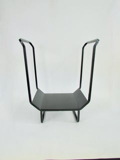 Studio made compact modernist wrought iron log holder in matte black finish
