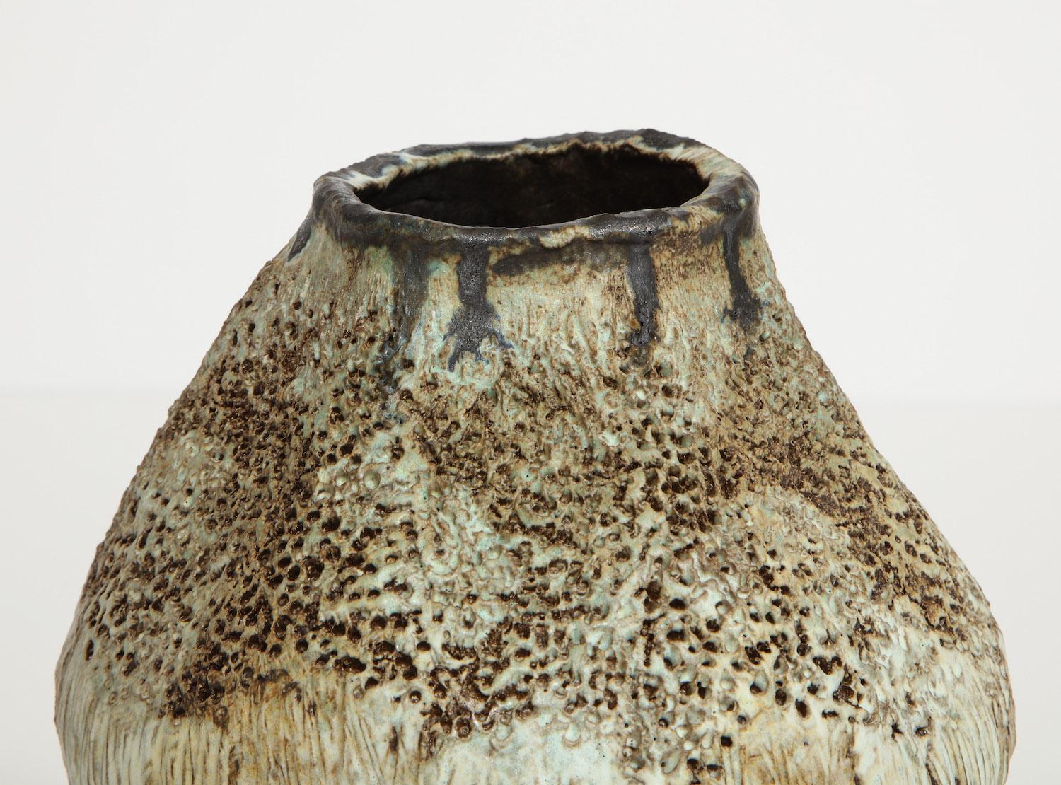 Bulbous form vase on central foot with great texture and pale glazes. Hand-built stoneware, signed and dated on underside.