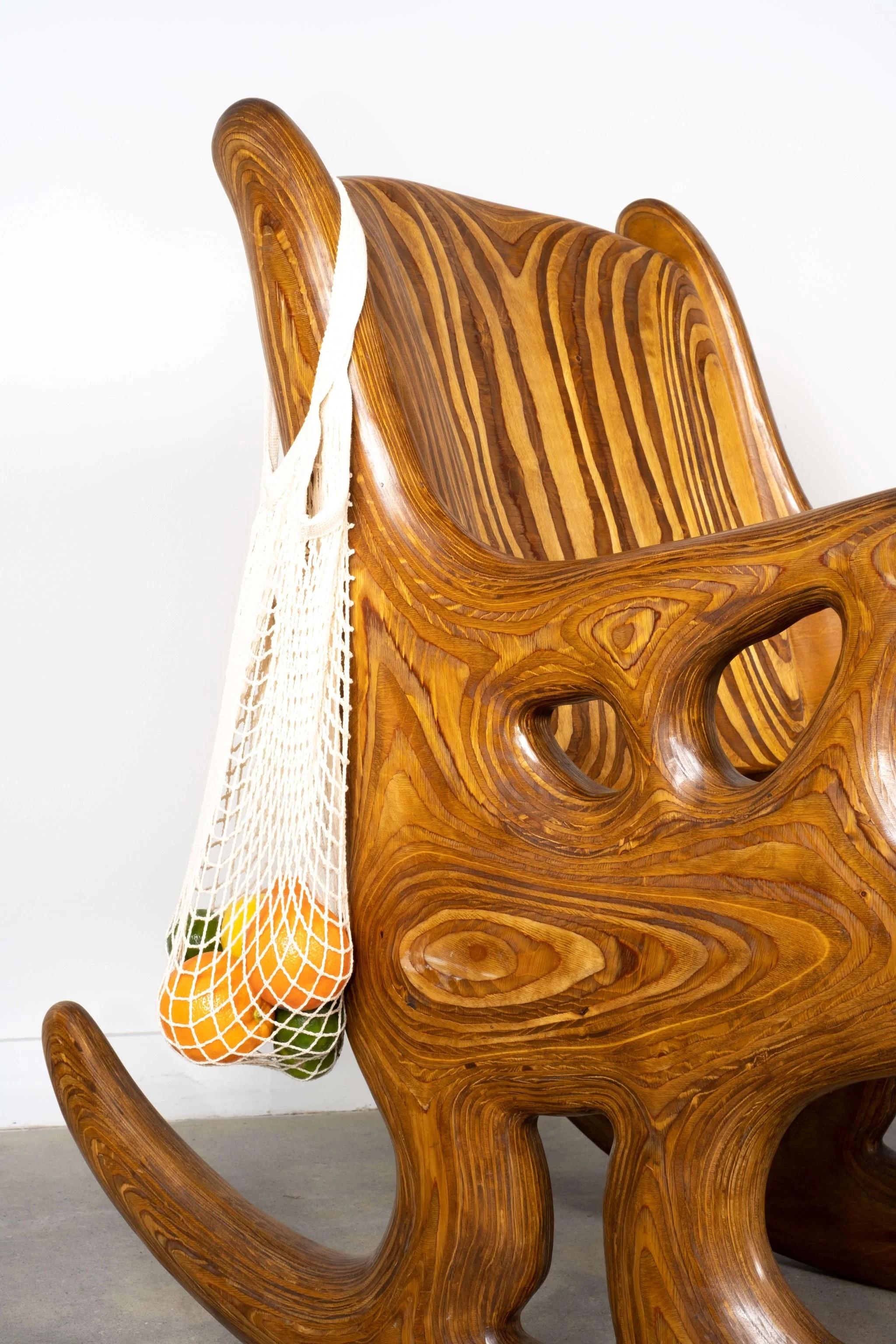 More art piece than furniture piece, this 1980s studio-made “Rocking Rocker Chair” by American artist Douglas Hackett is a study in woodworking. Its biomorphic shapes and smooth sculptural surface are a celebration of material.