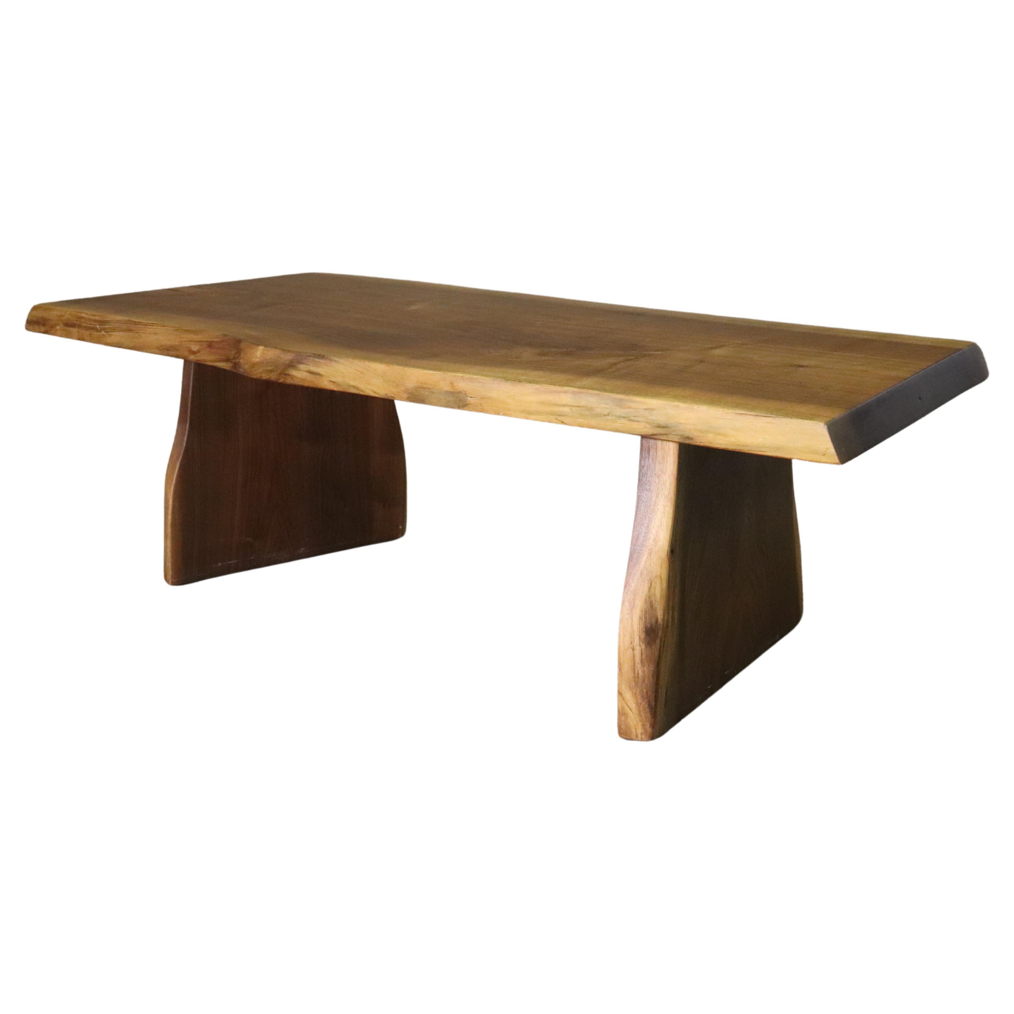 Beautifully constructed slab coffee table by Jeffrey Greene. Mid-century modern style live edge board with great color.
Please confirm location NY or NJ