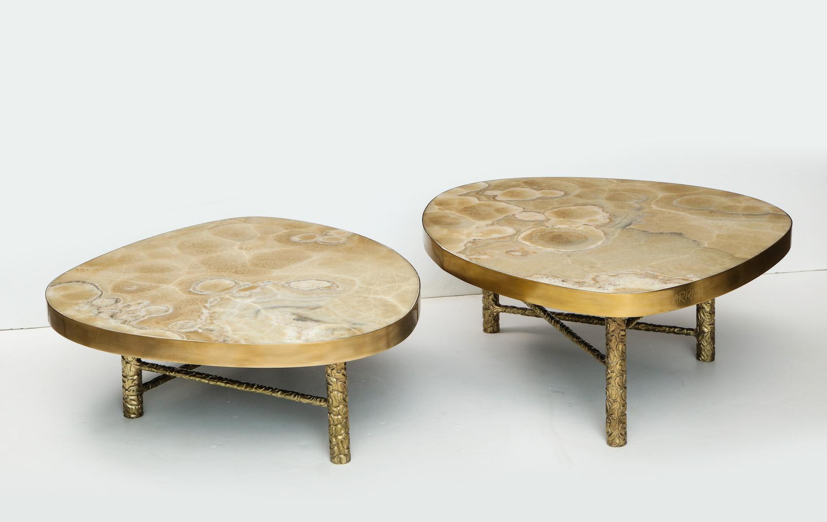 Set of 2 nesting tables in textured and brushed brass with highly-figured onyx tops. Made to order with a 15-20 week lead-time. Please get in touch to speak about customization options.