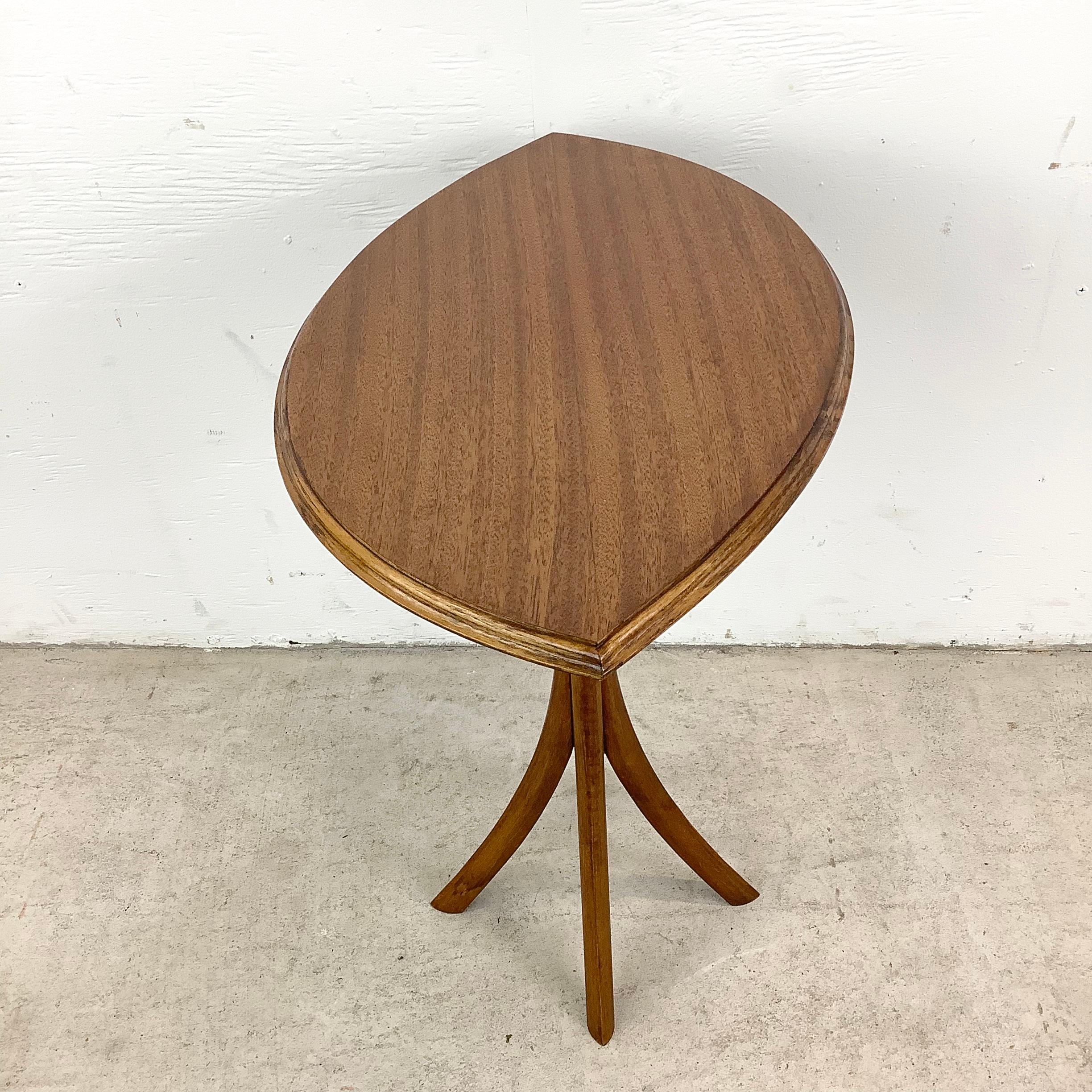 This unique sculptural studio made occasional table features a uniquely shaped solid wood top with tapered edge atop a  uniquely shaped bentwood base. From the hands of master woodworker designed this striking side table is the  perfect option to