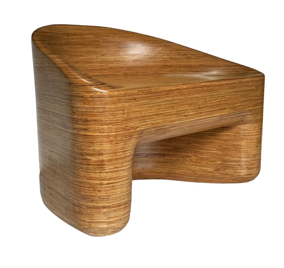 This laminated wood chair is a sculpted work of art. It consists of layered mixed woods. It has a satin sheen and is in great condition.  