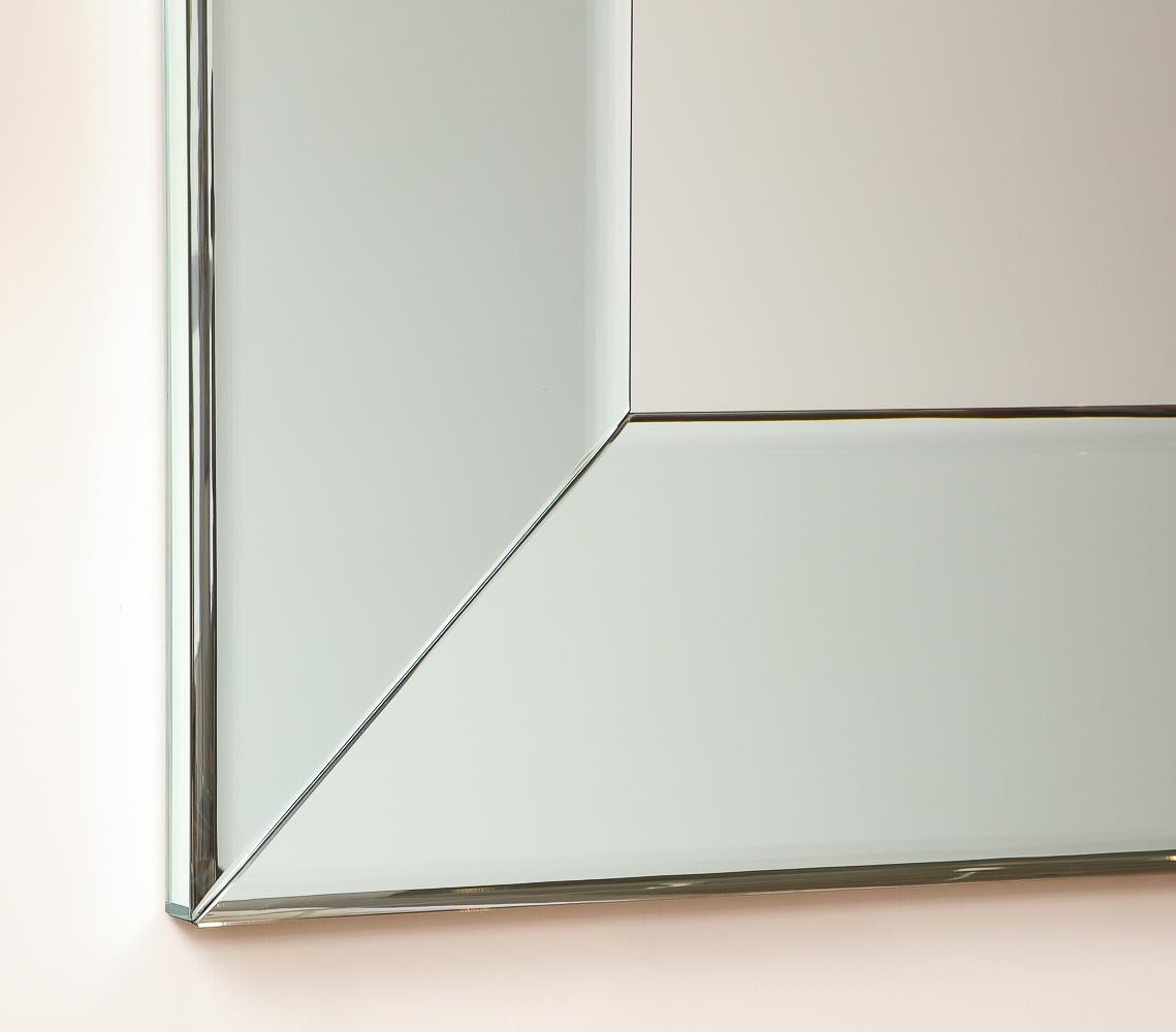 Beveled mirror, wood.  Large wall mirror with beveled  mirror frame surround.  Created in the studio of Roberto Giulio Rida in Milan.  