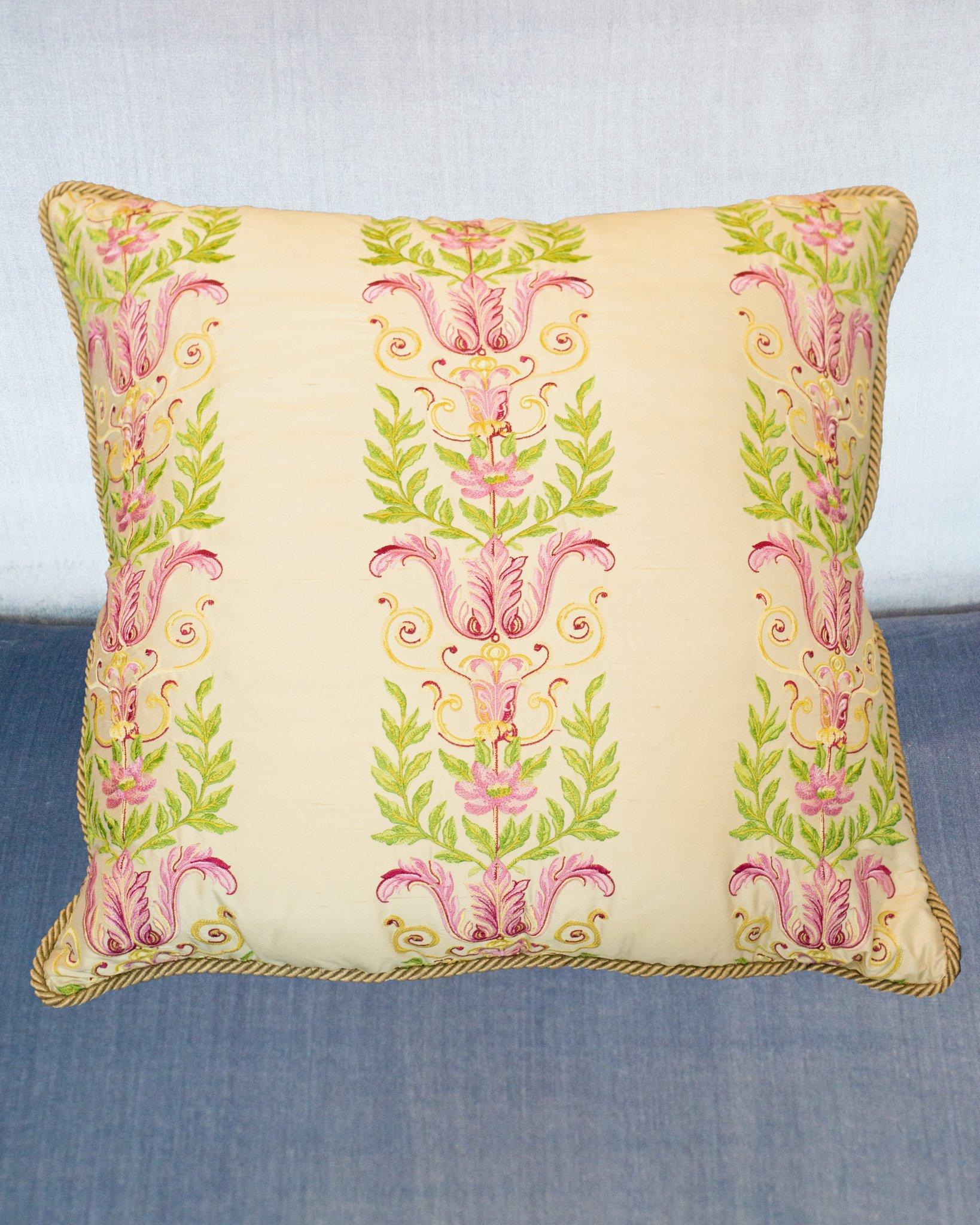A large Studio Maison Nurita handmade pillow with green and pink embroidery on crème silk, backed in a green cotton velvet with gold metallic rope, down filled.
