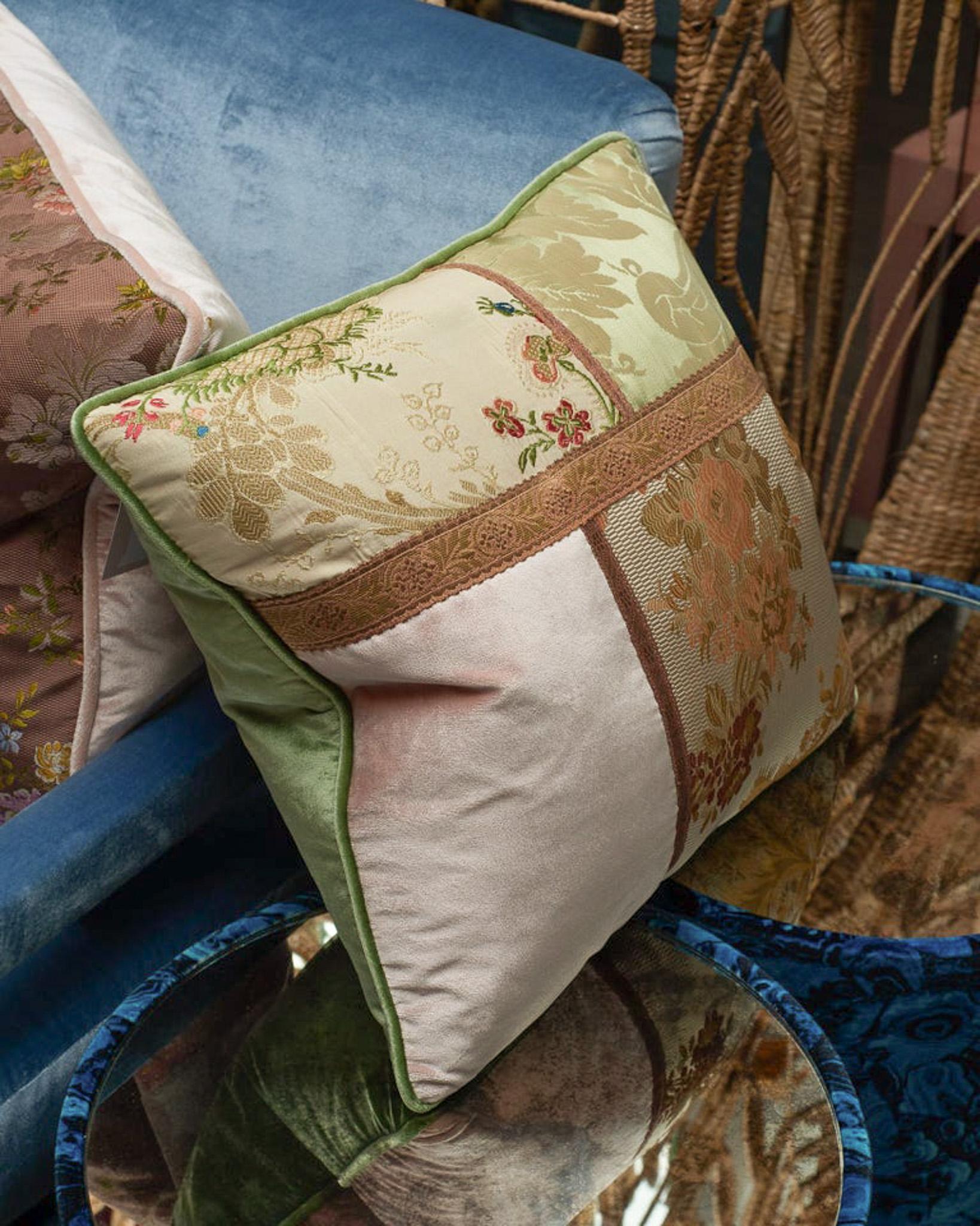 A Studio Maison Nurita handmade patchwork pillow in a variety of floral document prints, pink and green silk velvet, and metallic trims. Filled with Canadian down and feather.