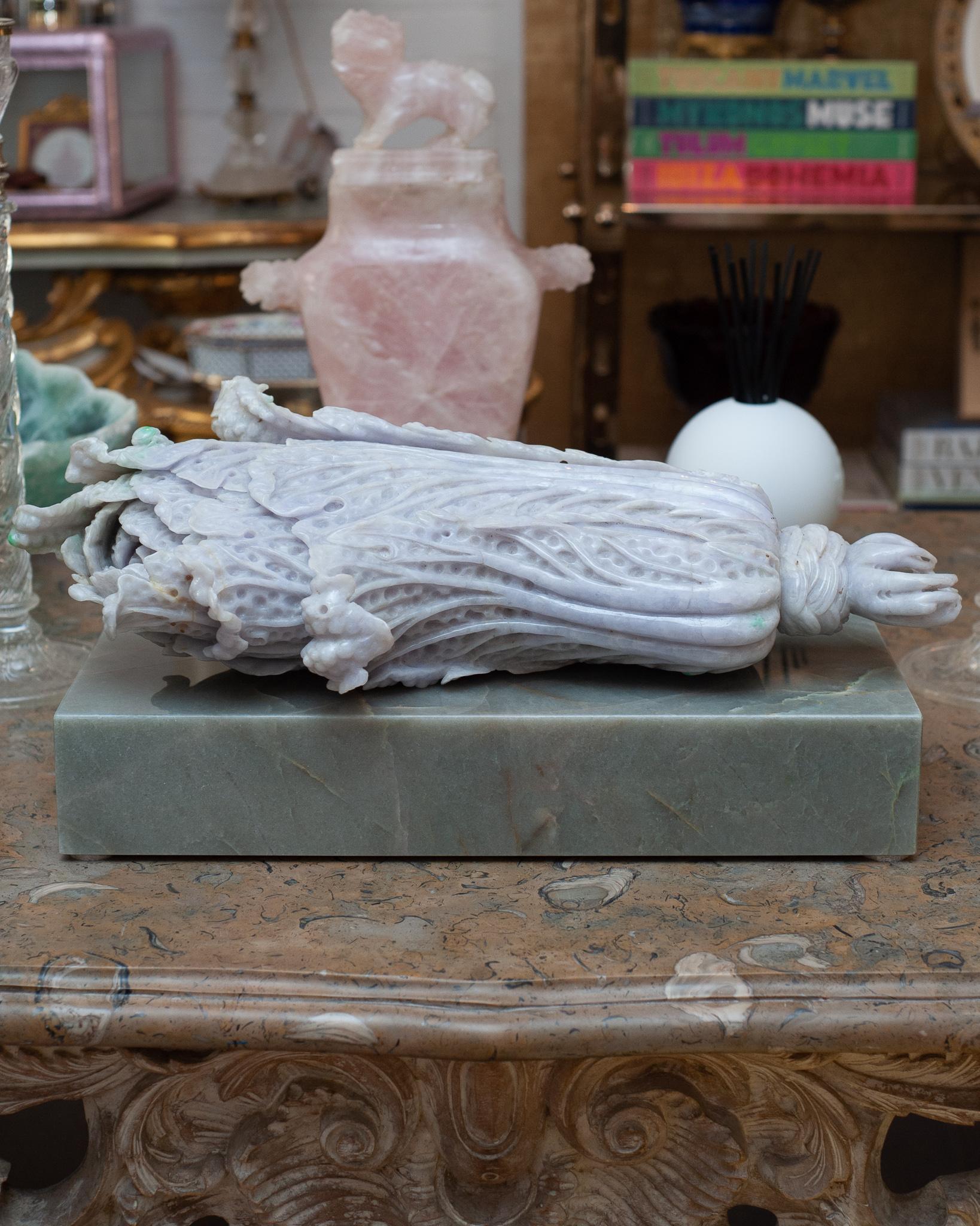An exceptional museum quality antique lavender and green jade cabbage on a custom made green marble block plinth by Studio Maison Nurita. This cabbage is beautifully hand carved and polished in a light lavender tone with hints of green. Jade is a