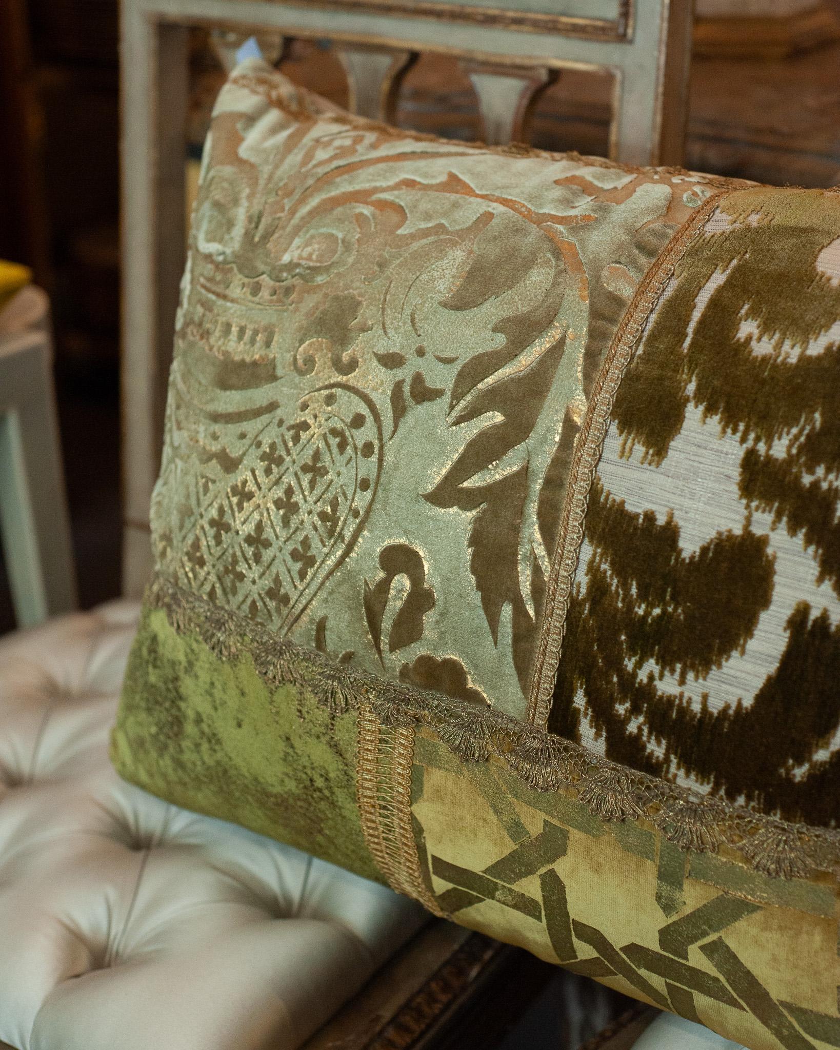 A large Studio Maison Nurita handmade patchwork pillow in a variety of green cut pile silk velvets, vintage metallic trims and down filled.