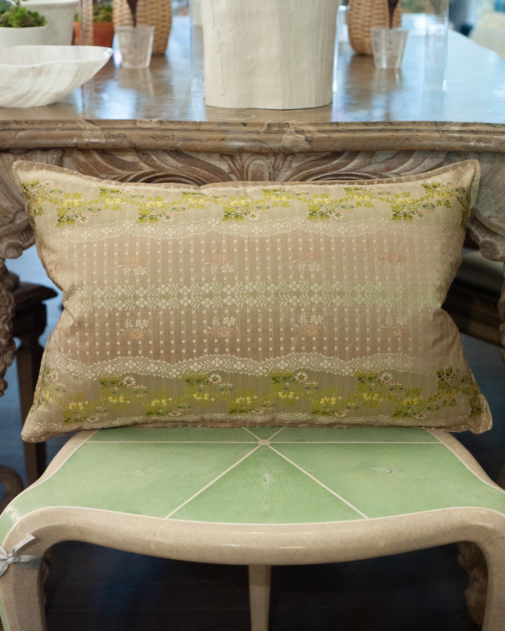 A luxurious Studio Maison Nurita pillow made from a soft pink document print floral brocade, with a tonal soft pink silk back. This pillow is filled with 80/20 Canadian down and feather for a pillow that feels as beautiful as it looks.
