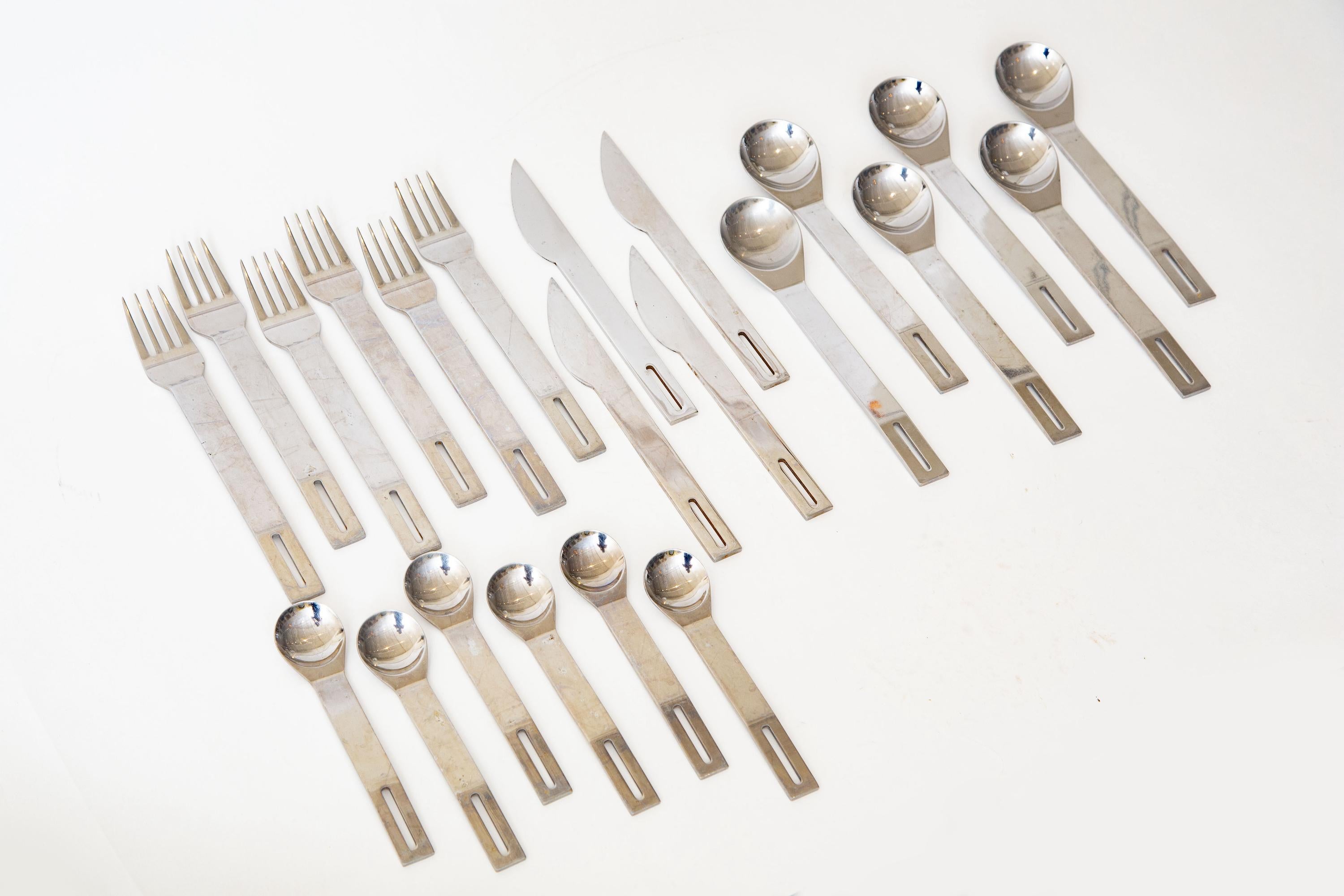 This architectural and sculptural flatware that is Studio Nova Japan is from the 80's. It is a set of 6 but missing 2 of the knives. It is stainless steel and marked stainless Japan. It has not been professionally polished. This is an uncommon set