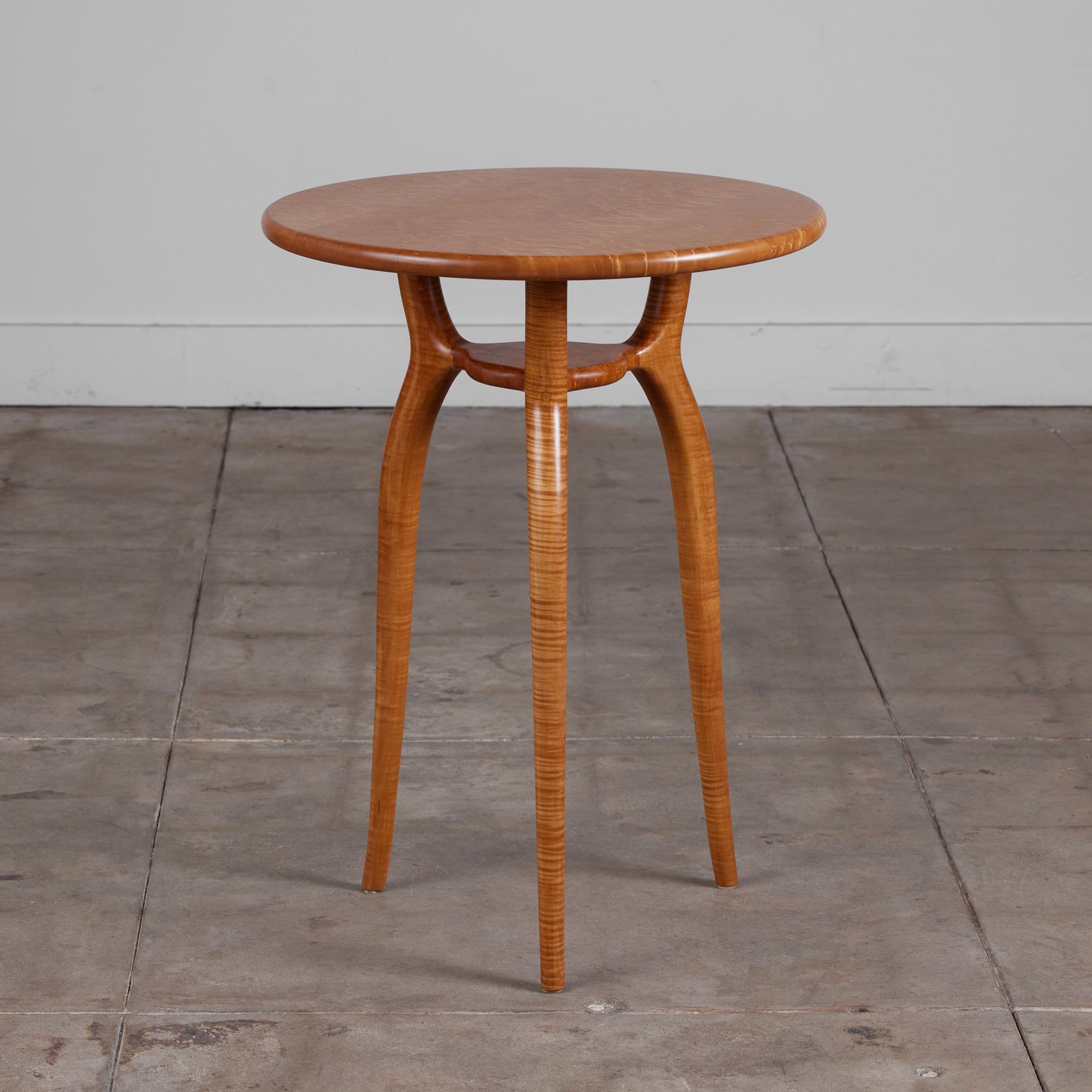 Studio pedestal or console height side table circa 1976. This table top is crafted from solid Bird's Eye and the sculpted legs are comprised of Tiger Maple. The contrasting wood makes for an exciting and elegant finish to this organic shaped