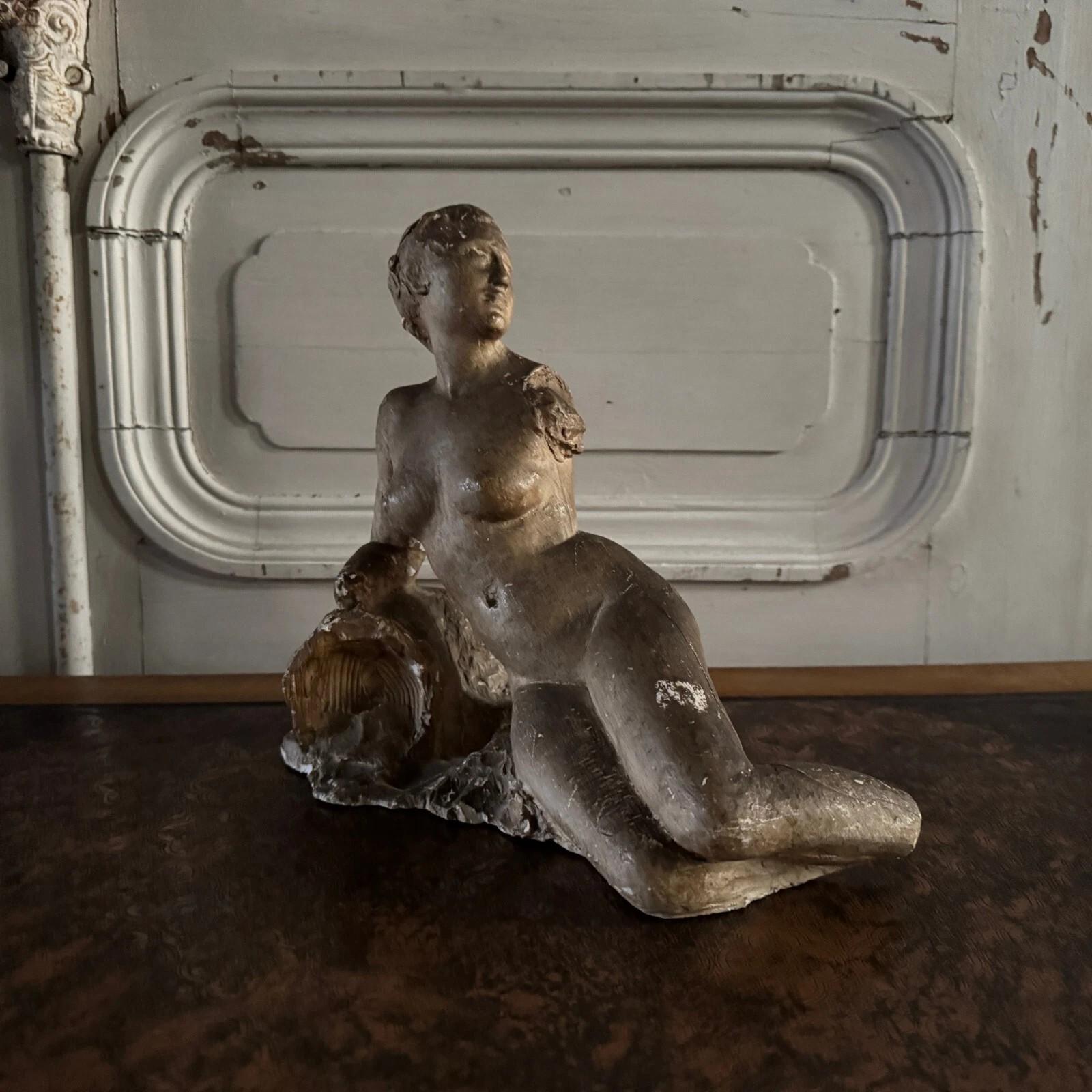 French Studio plaster by Charles Filleul depicting a nude young woman seated on a rock. For Sale