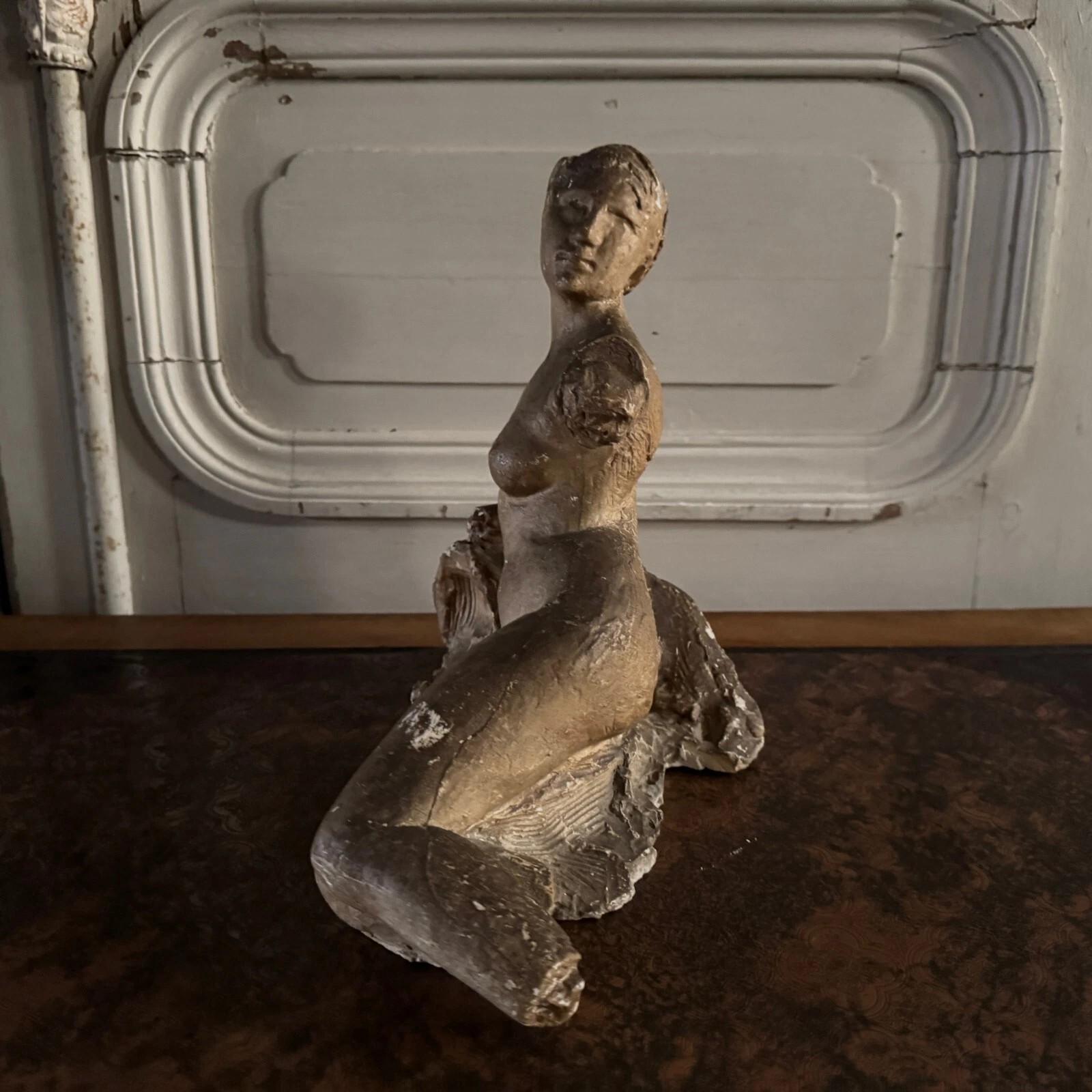 Hand-Carved Studio plaster by Charles Filleul depicting a nude young woman seated on a rock. For Sale