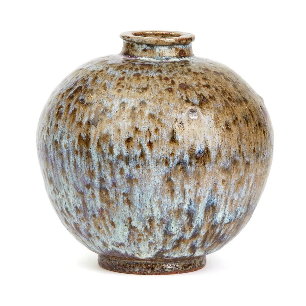 A stylish Studio Pottery stoneware vase of rounded bulbous shape with a raised narrow top and streak glazed in tones of brown, green and blue. The vase has a hand applied signature mark SRM to the base.

Provenance: From the collection of studio
