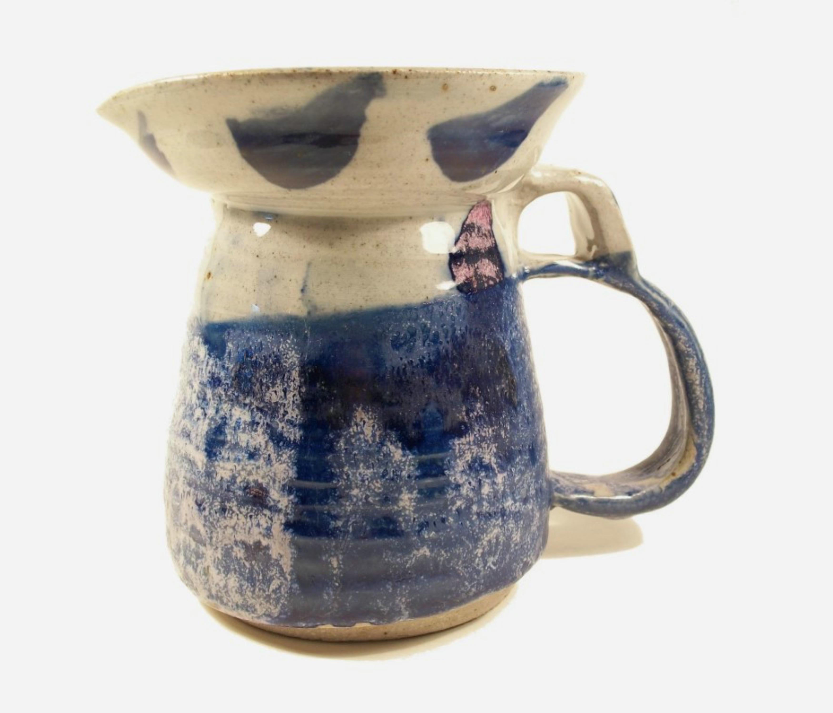 Large studio pottery glazed stoneware pitcher - heavily potted - wheel thrown with hand modeled and applied handle - hand painted glaze - signed/initialed on the base 'MD' - Canada (likely) - circa 1994.

Excellent vintage condition - no loss - no