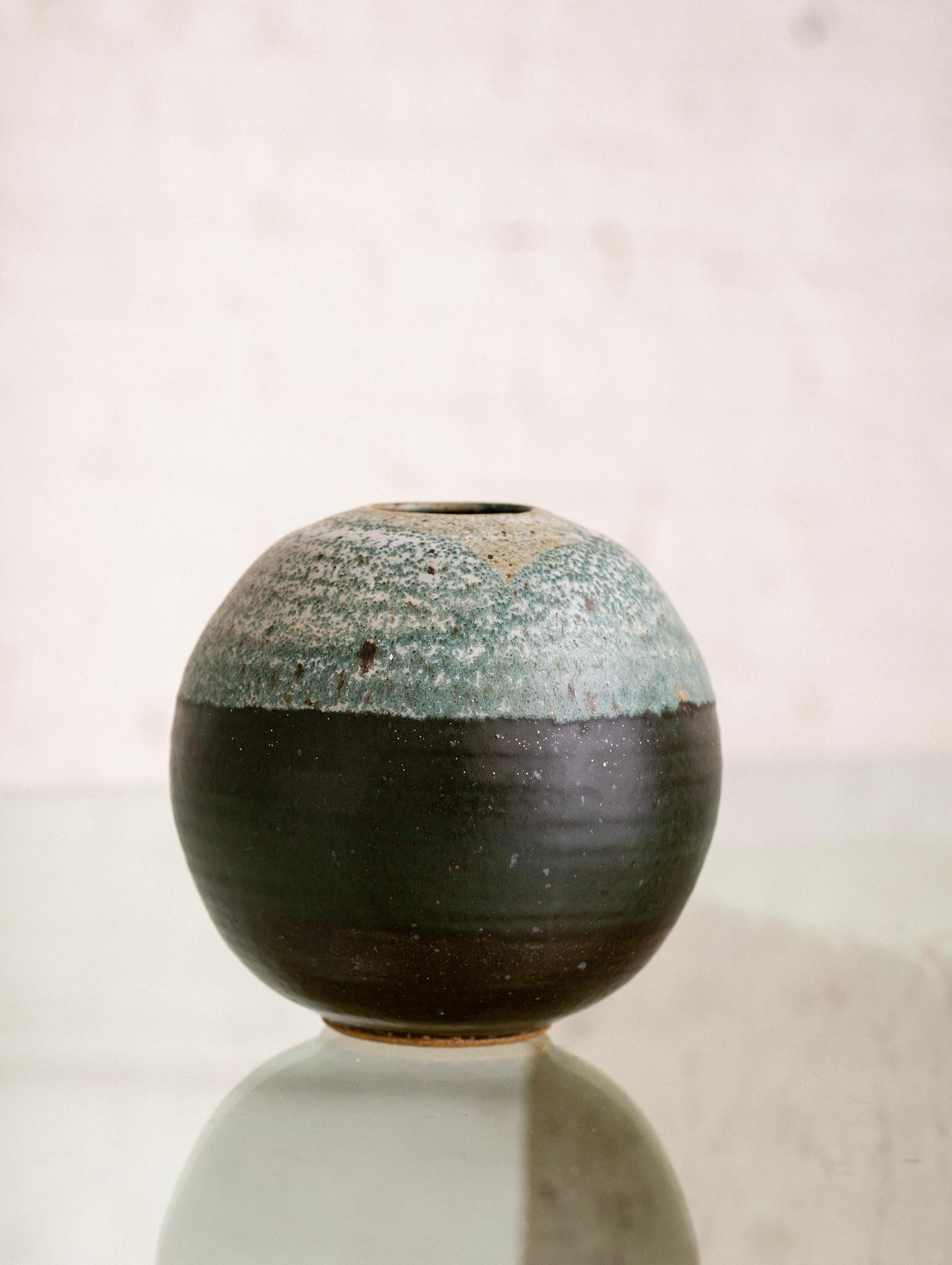 Studio pottery vase. Globe form with two toned teal glaze.
